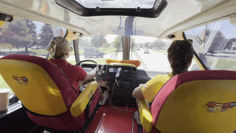 Image shows a woman driving the Wienermobile in Metairie.