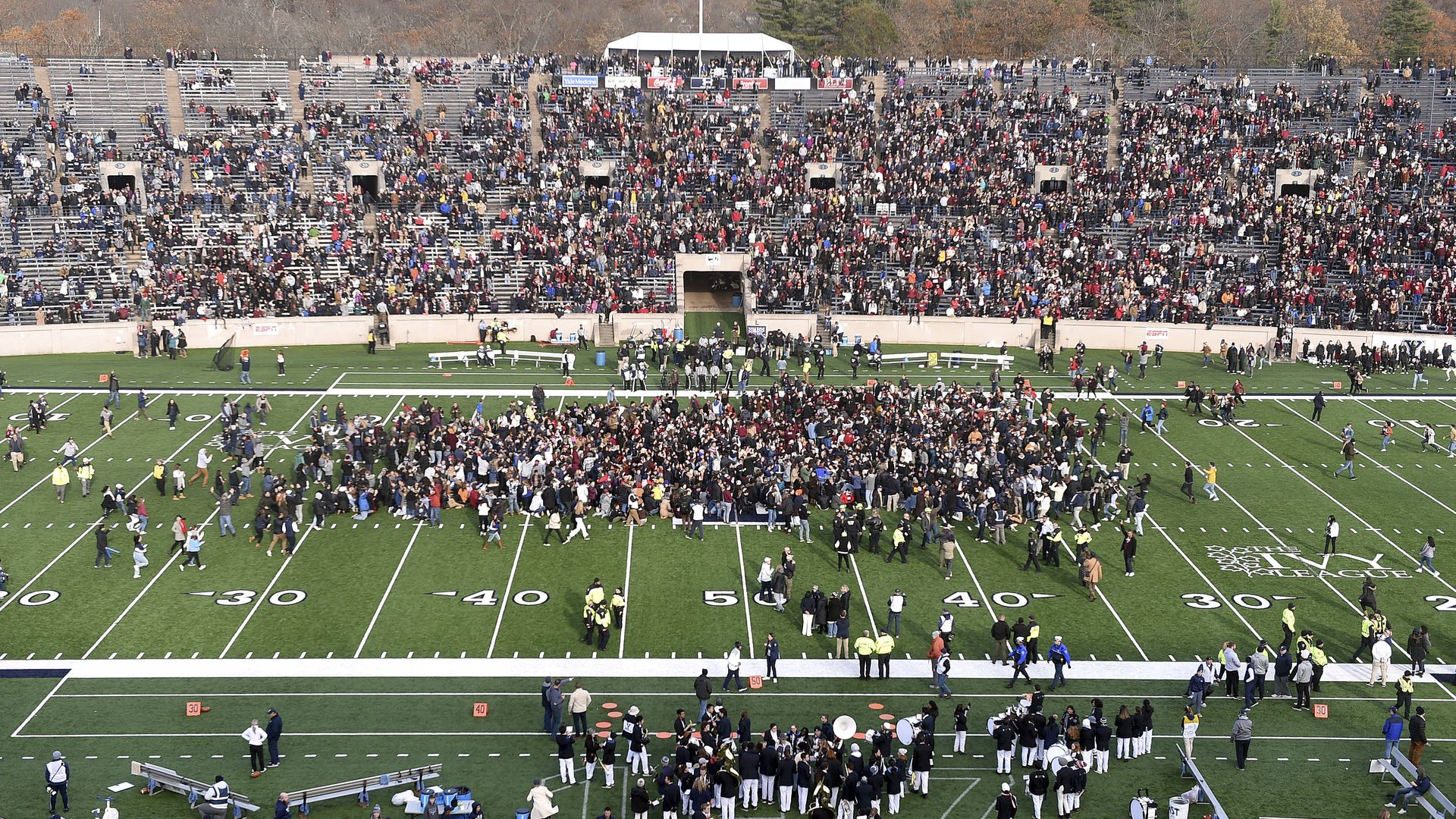 Protesters swarm the field at a Harvard-Yale football game.
