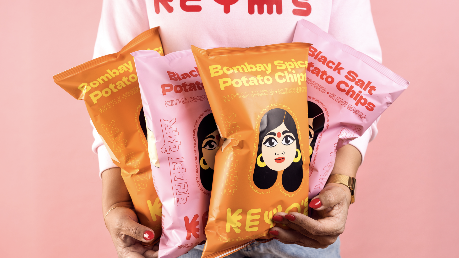 pink and orange bags of chips with an Indian woman on them 