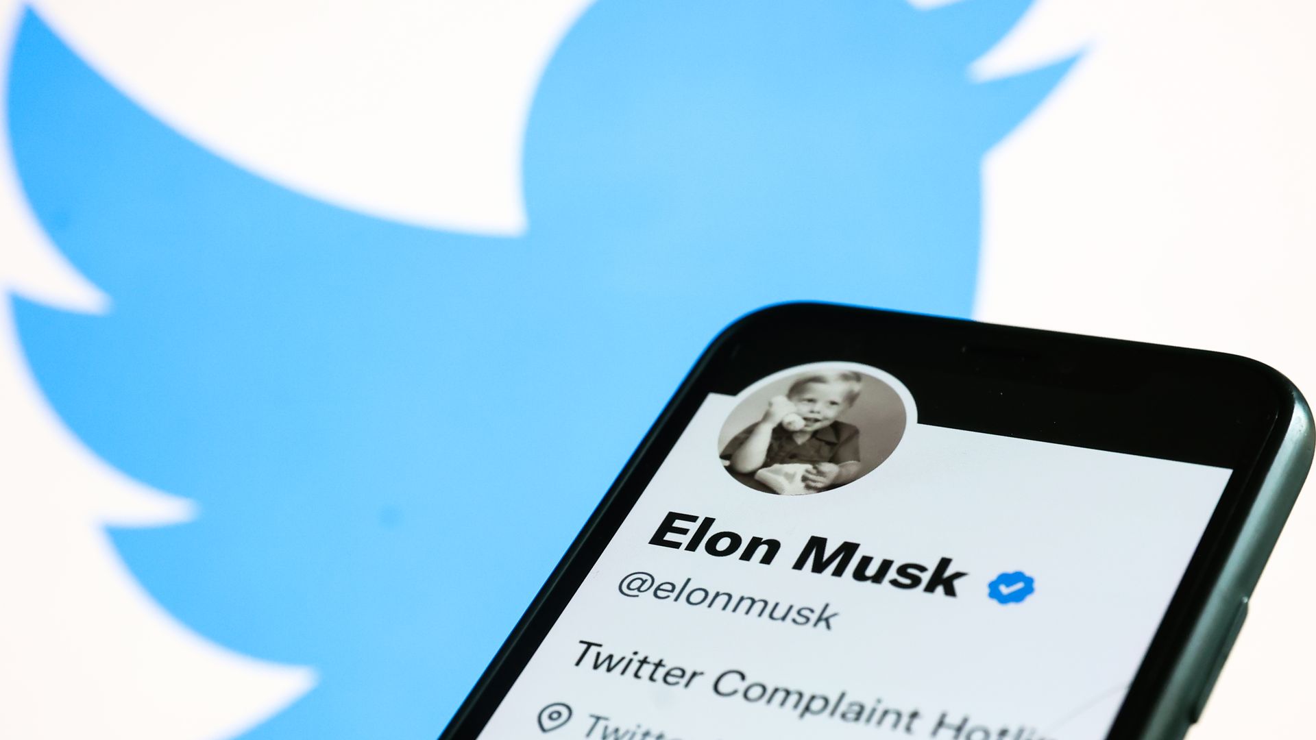 Elon Musk's Twitter account displayed on a phone screen and Twitter logo displayed on a laptop screen are seen in this illustration photo taken in Krakow, Poland on November 1