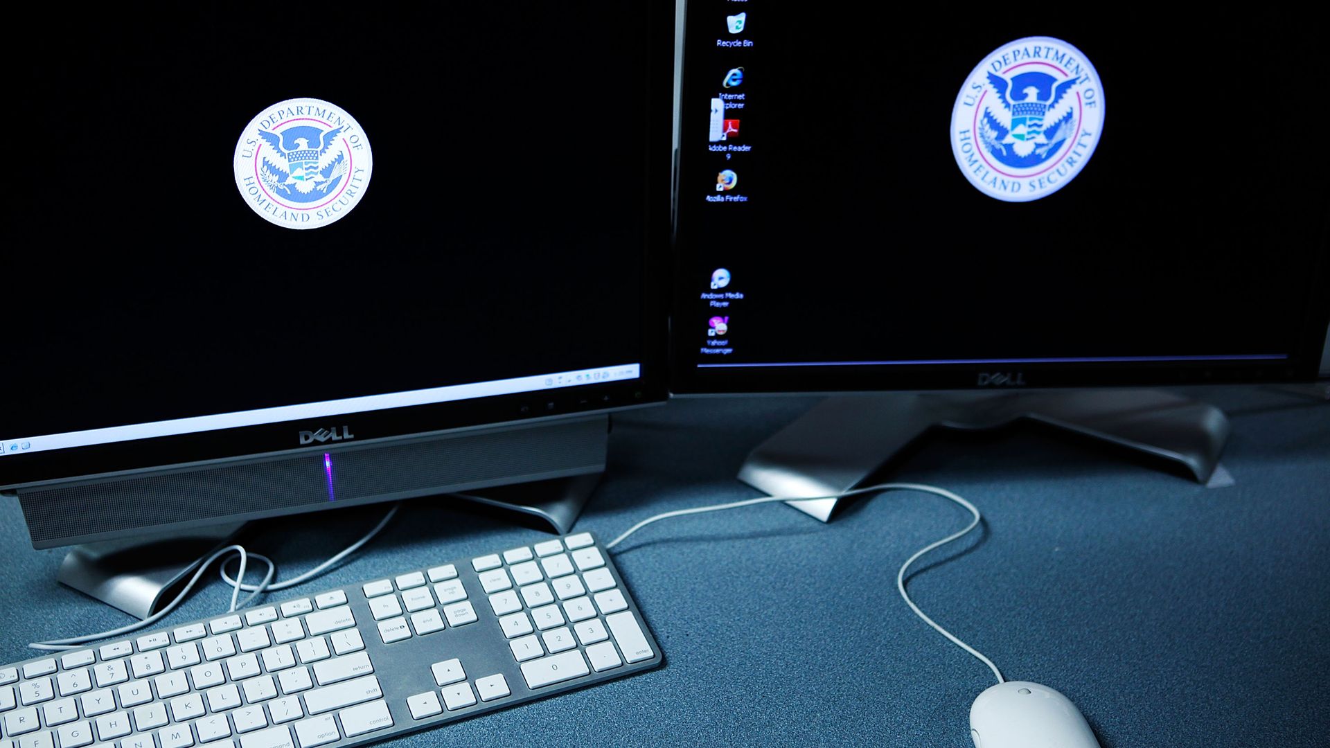 The logos of the U.S. Department of Homeland Security are seen on computer terminals in a training room of the Cyber Crimes Center of the U.S. Immigration and Customs Enforcement