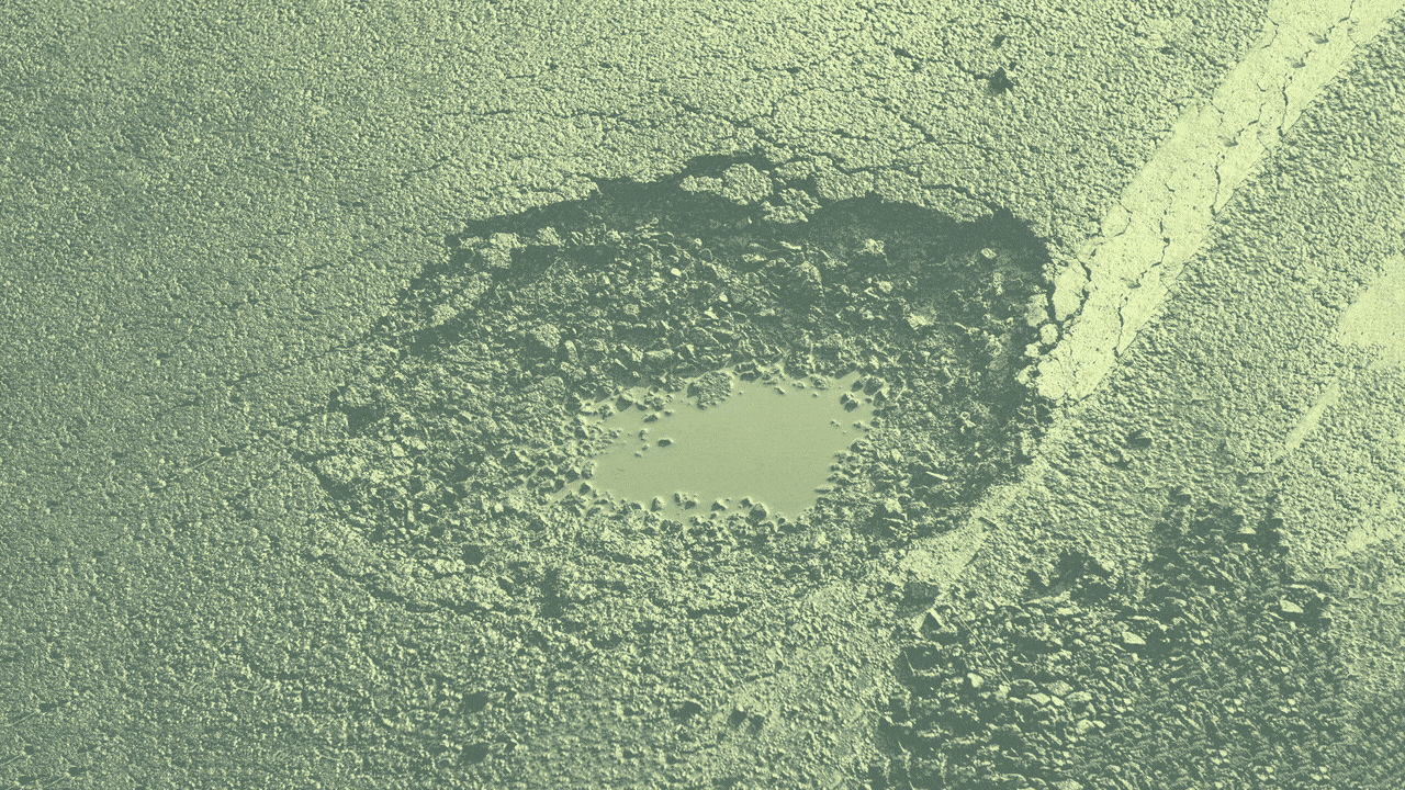 Illustration of a pothole with a spray-painted no sign being drawn over it.