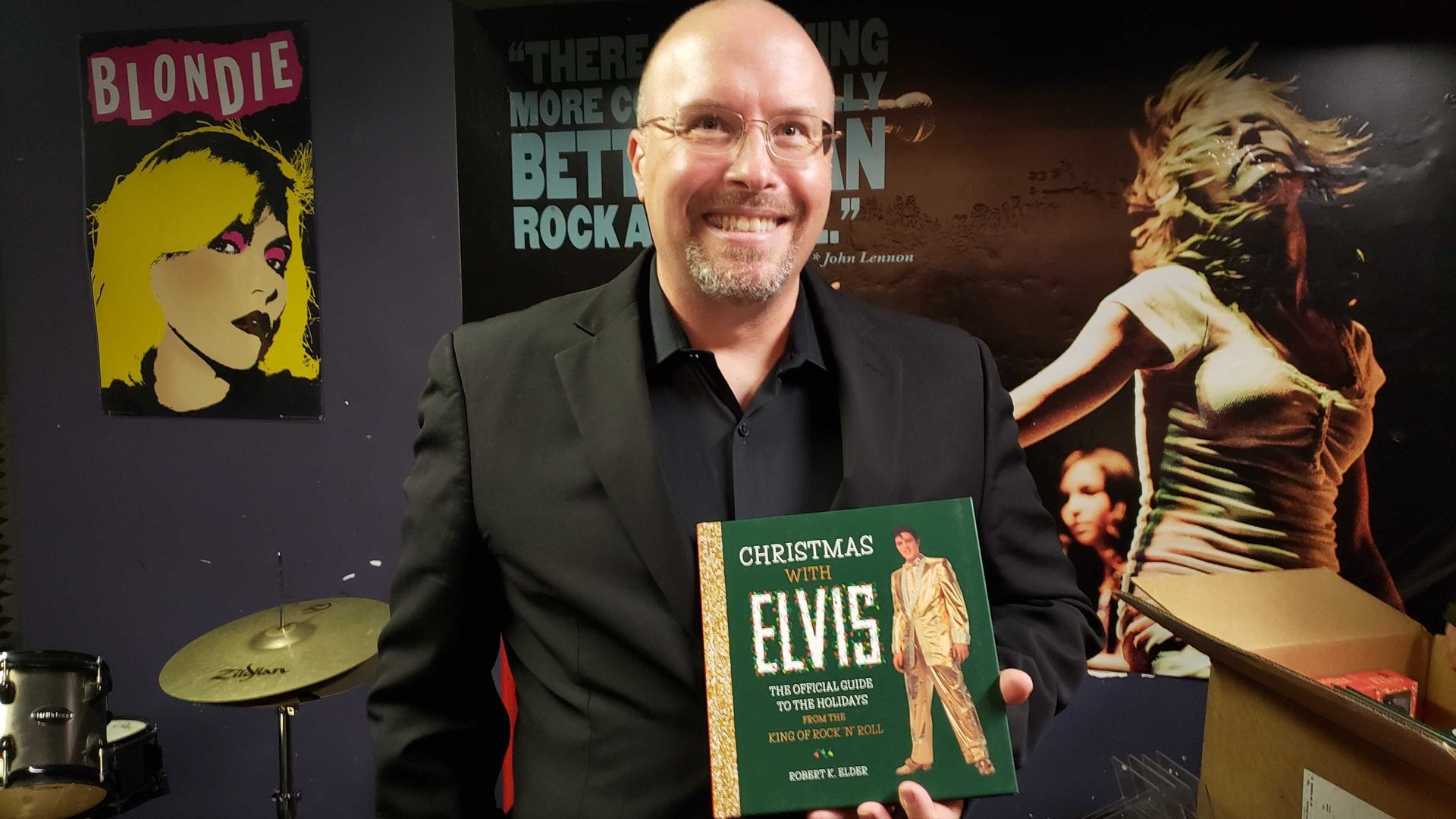 Author with book in his hand. 