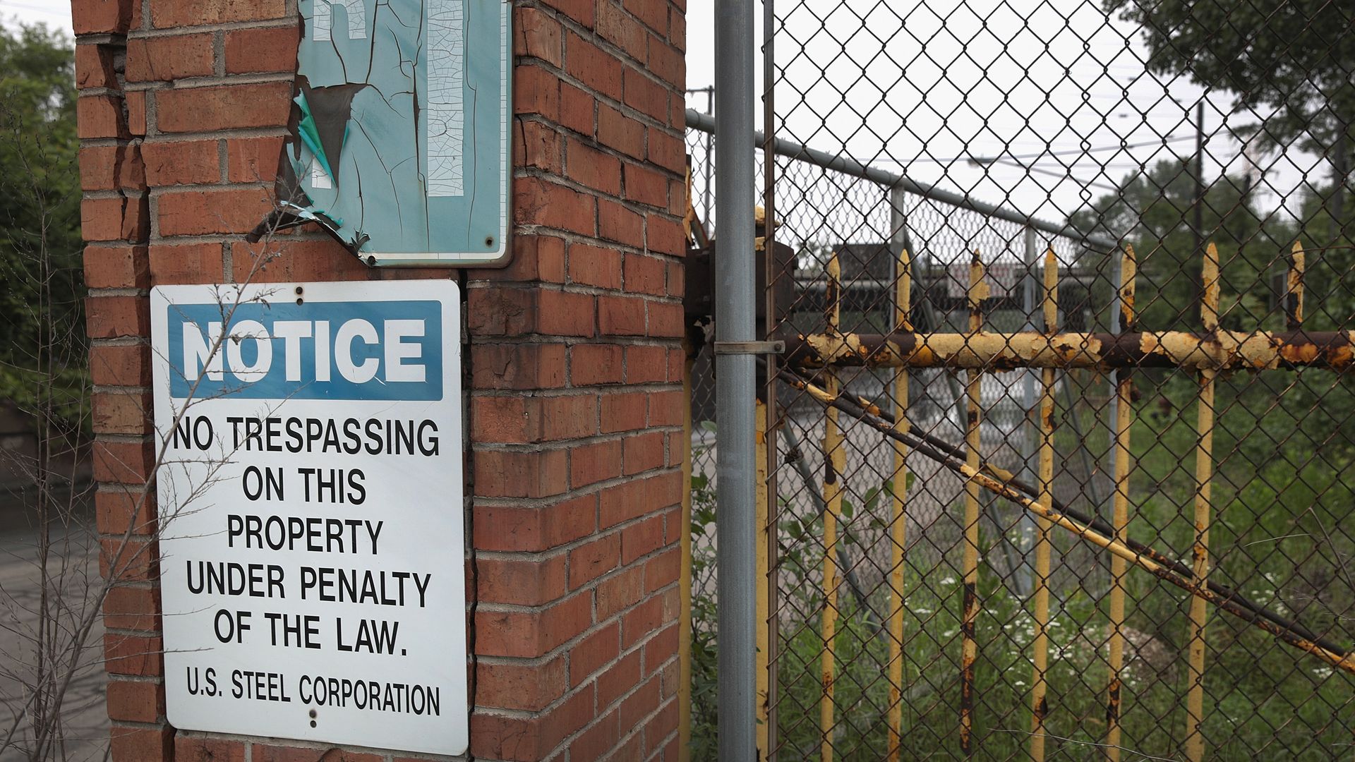 A sign warning against trespassing is posted on a fence that surrounds U.S. Steel's Gary Works facility.