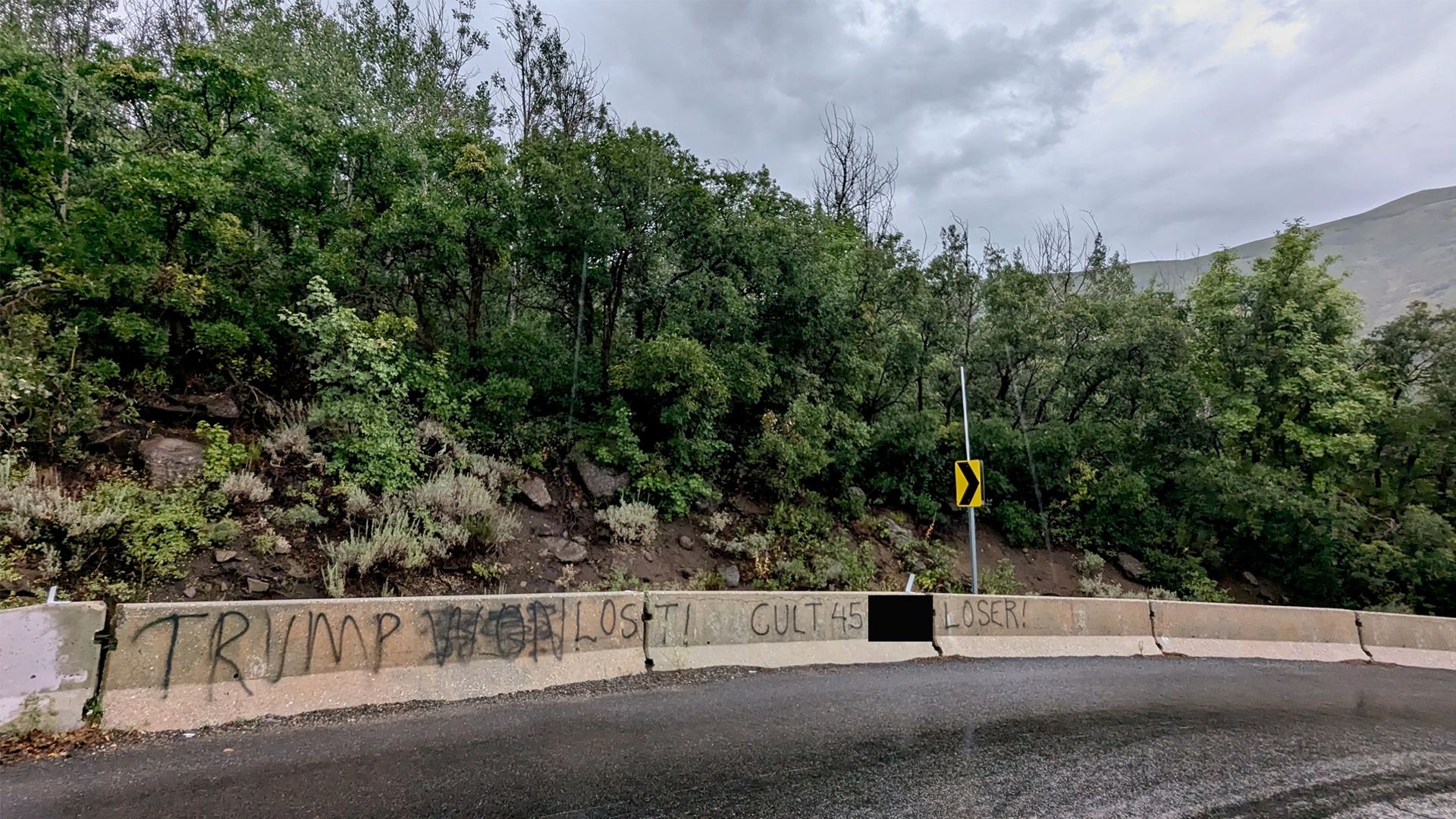 An image of profane graffiti on a road in Utah 