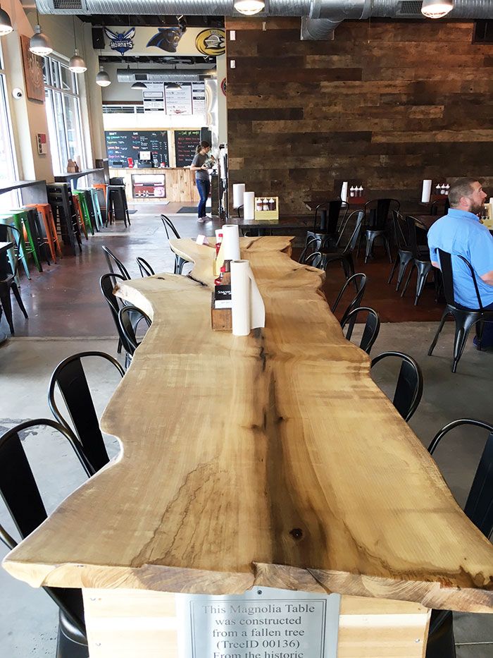 new-wooden-table-at-sauceman's-bbq-charlotte