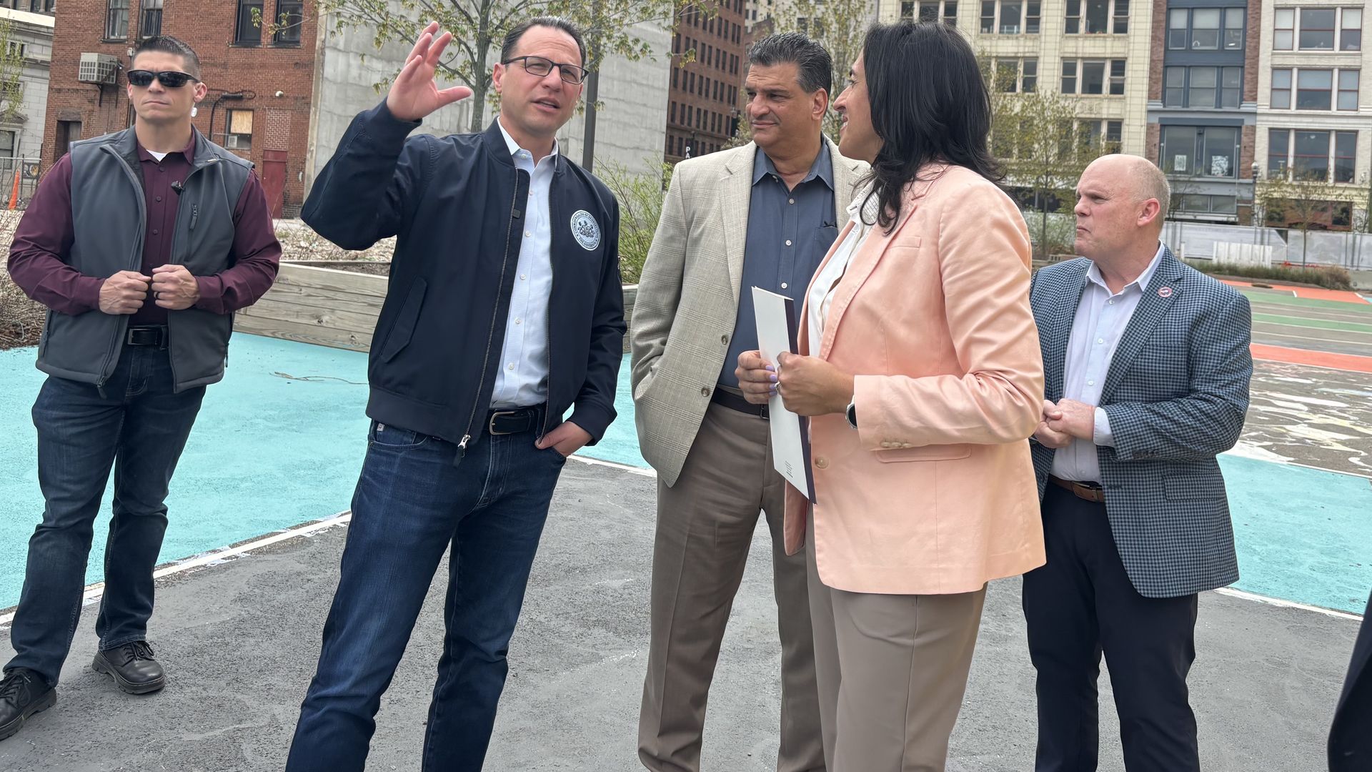 Gov. Josh Shapiro tours Arts Landing park  in April 2025 with local Pittsburgh officials before it starts construction 