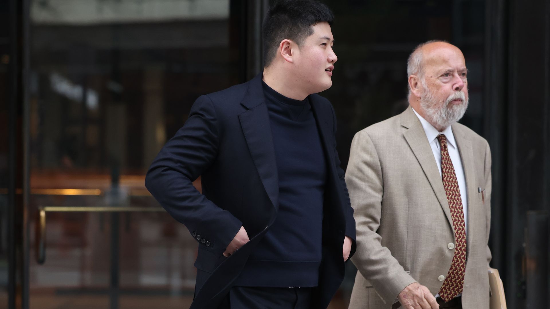 Two men at a courthouse