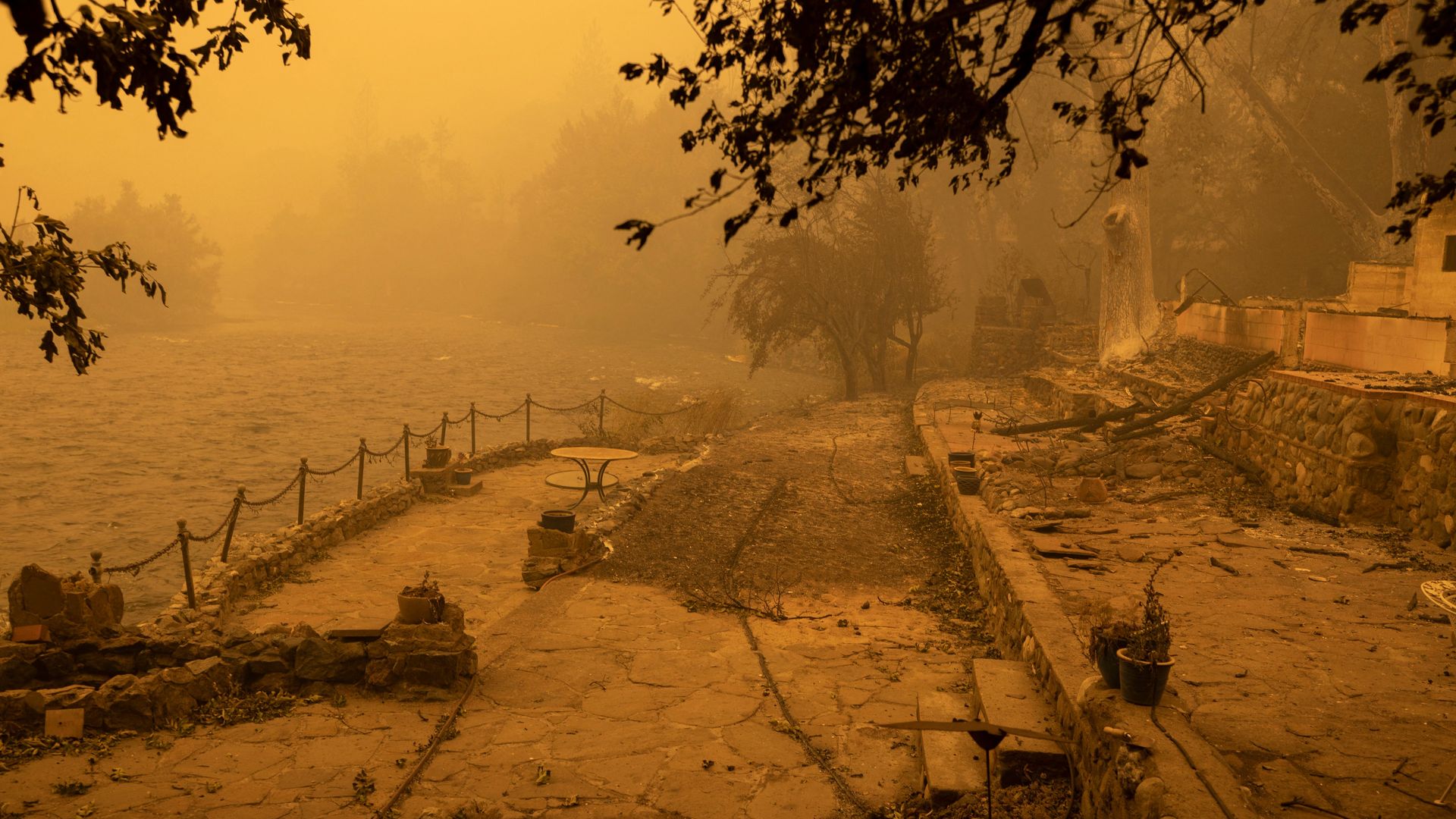 River-front property in the community of Klamath River lies in ruins after it burned in the McKinney Fire in the Klamath National Forest, northwest of Yreka, California, on July 31, 2022.