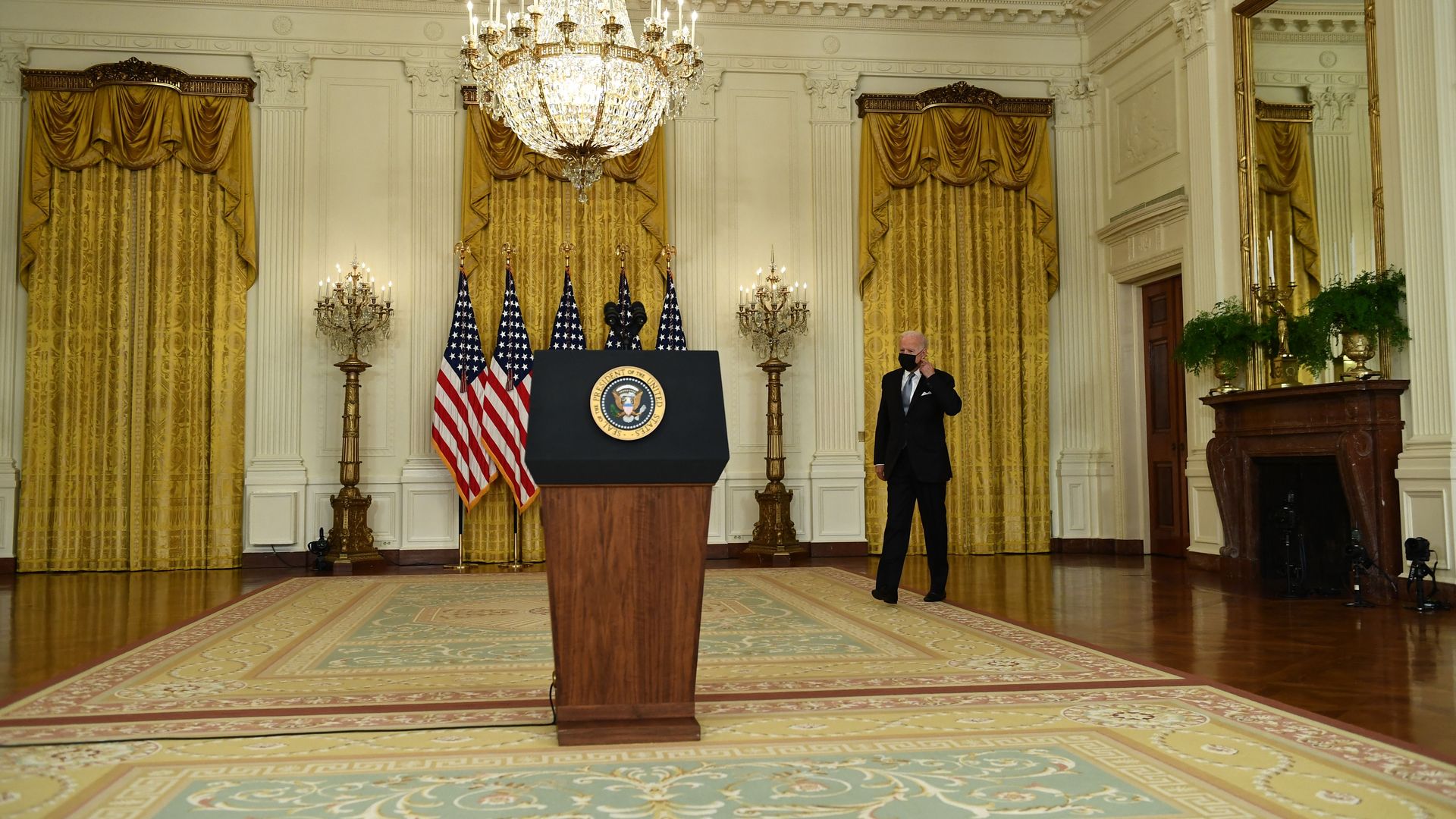 Biden arrives to speak at the White House podium