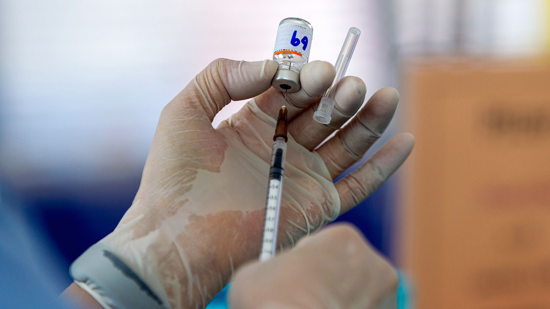 A healthcare worker prepares the Pfizer-BioNTech COVID-19 vaccine