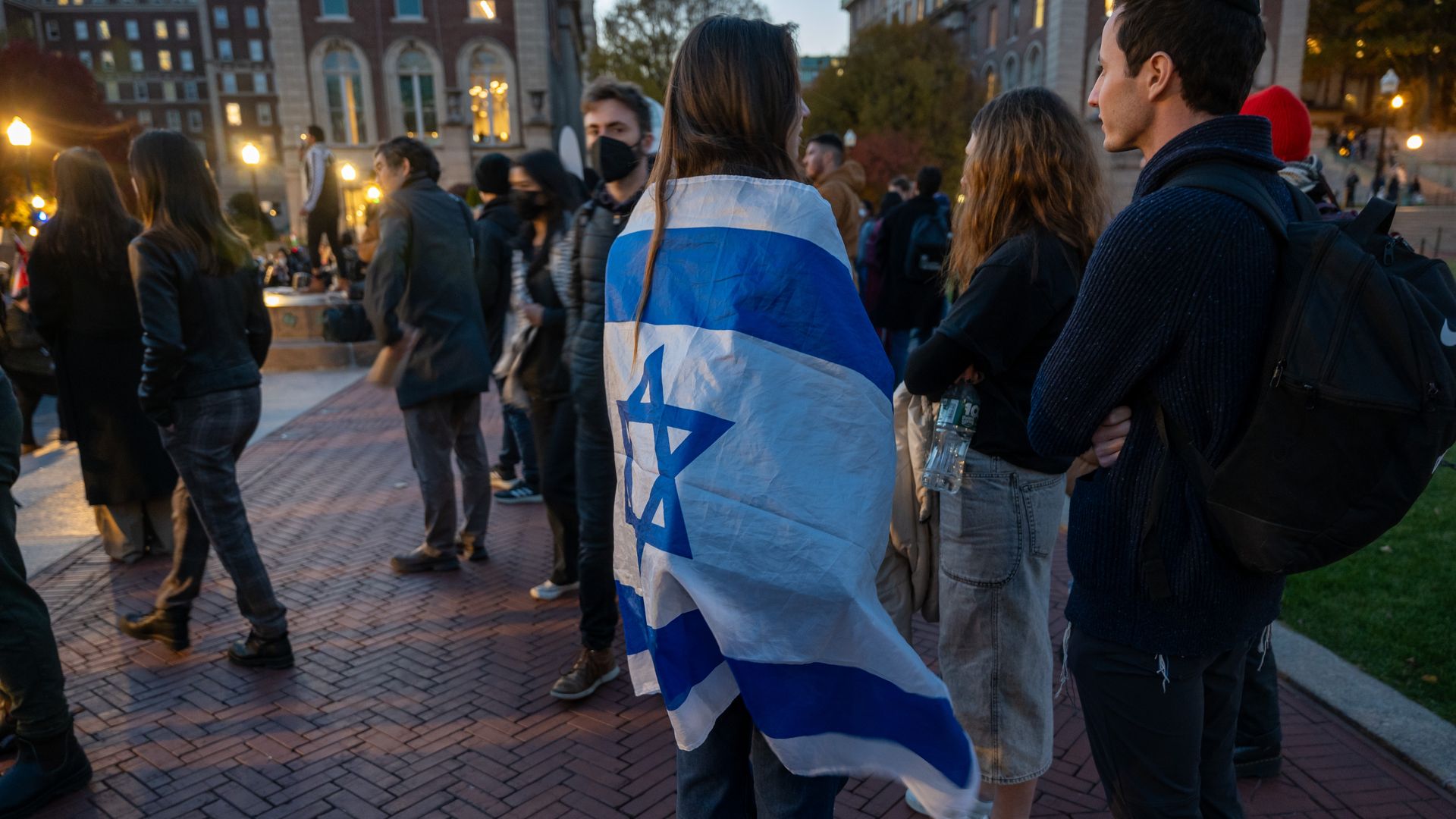 A student wrapped in an Israel flag on Columbia University's campus.