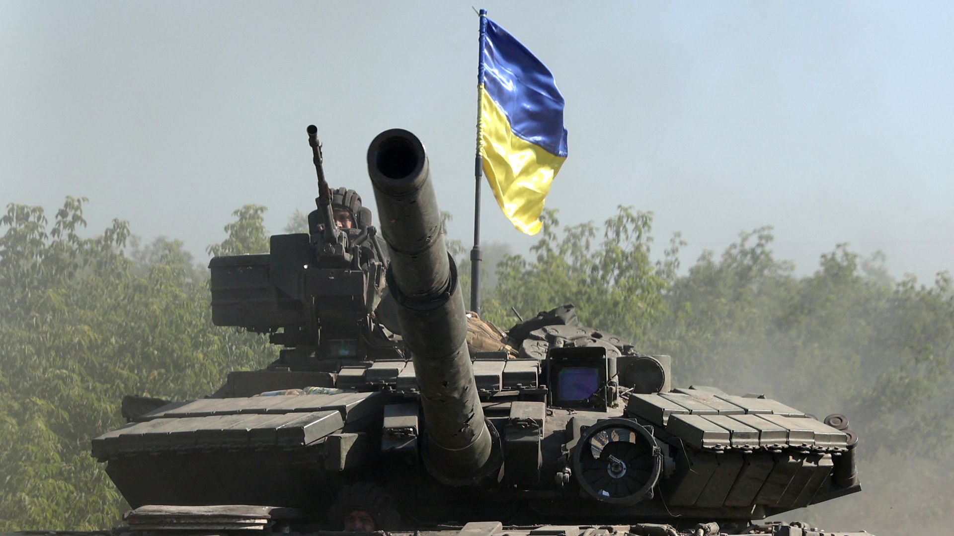 Ukrainian troops ride a tank on a road of the eastern Ukrainian region of Donbas on June 21.