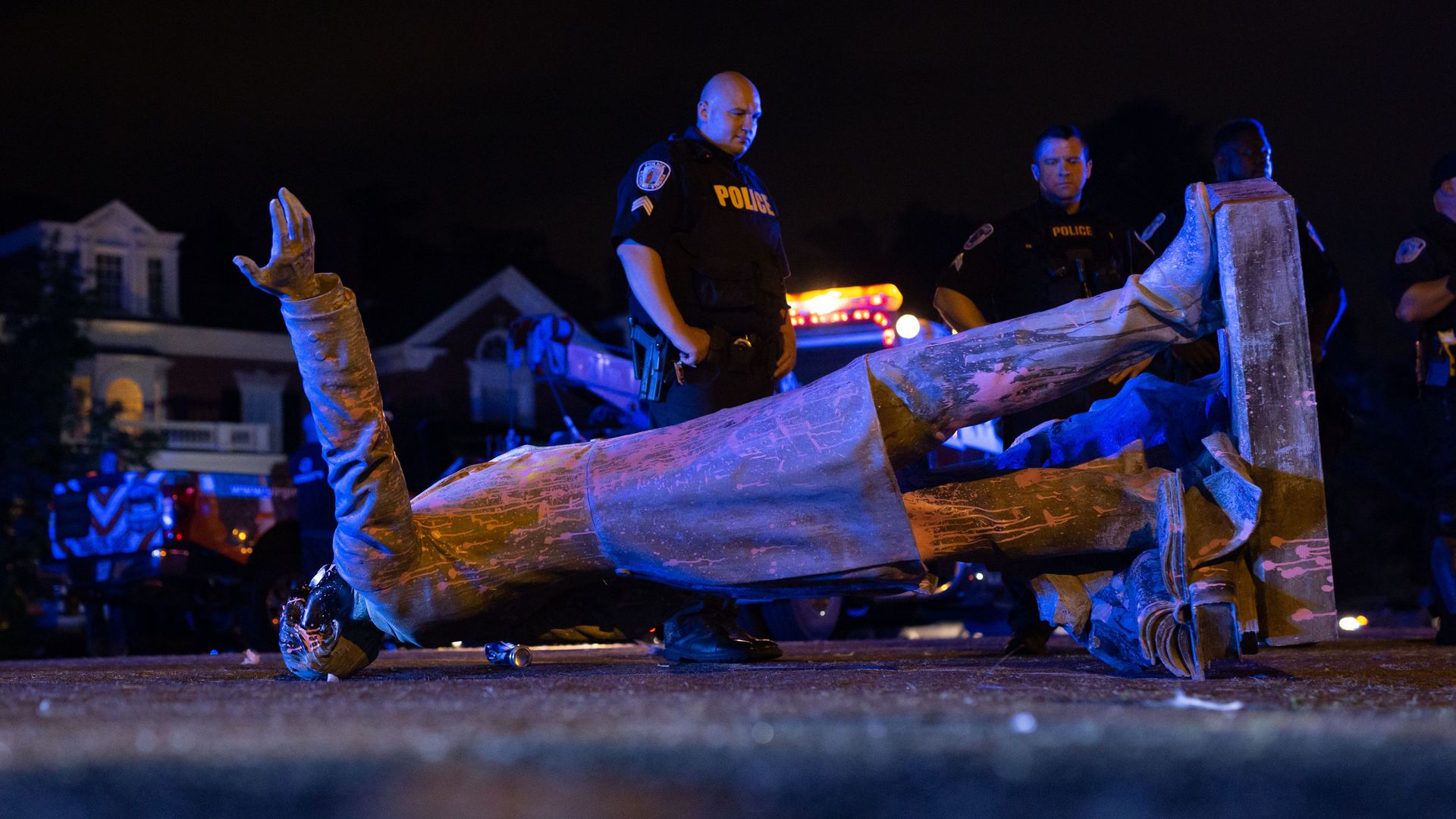 A statue of Confederate States President Jefferson Davis lies on the street after protesters pulled it down in Richmond, Virginia, on June 10