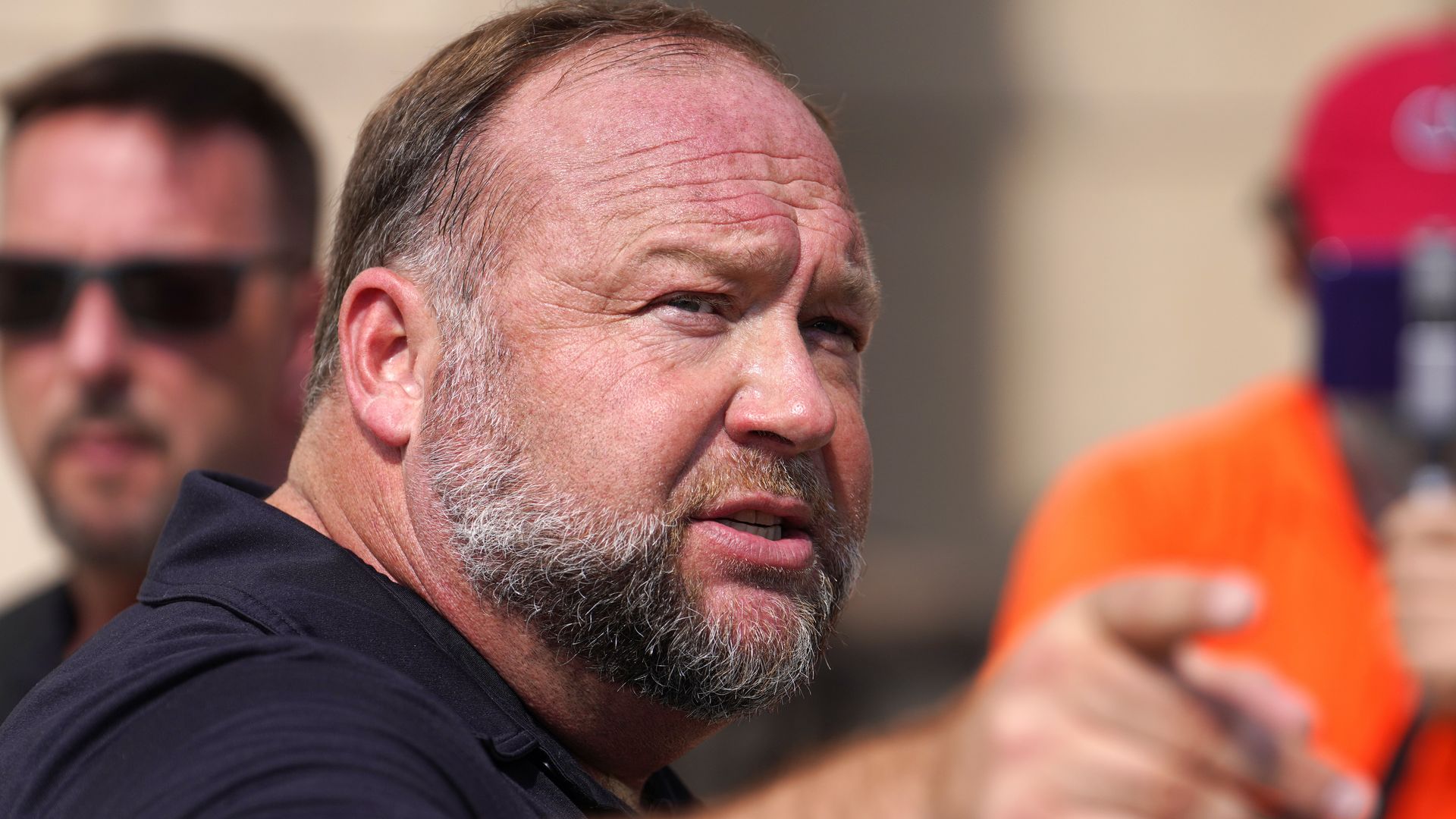 Alex Jones speaking outside a courthouse in Waterbury, Connecticut, in September 2020.