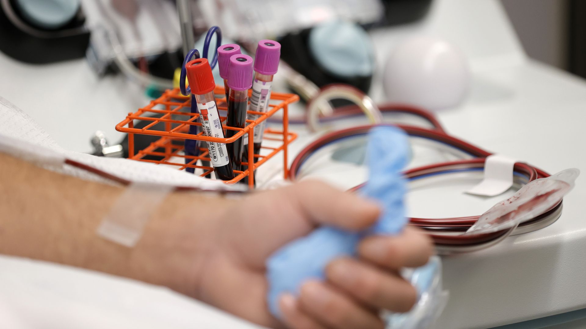 Vials of blood sit on a table as a man donates blood on January 11, 2022 in San Francisco, California.