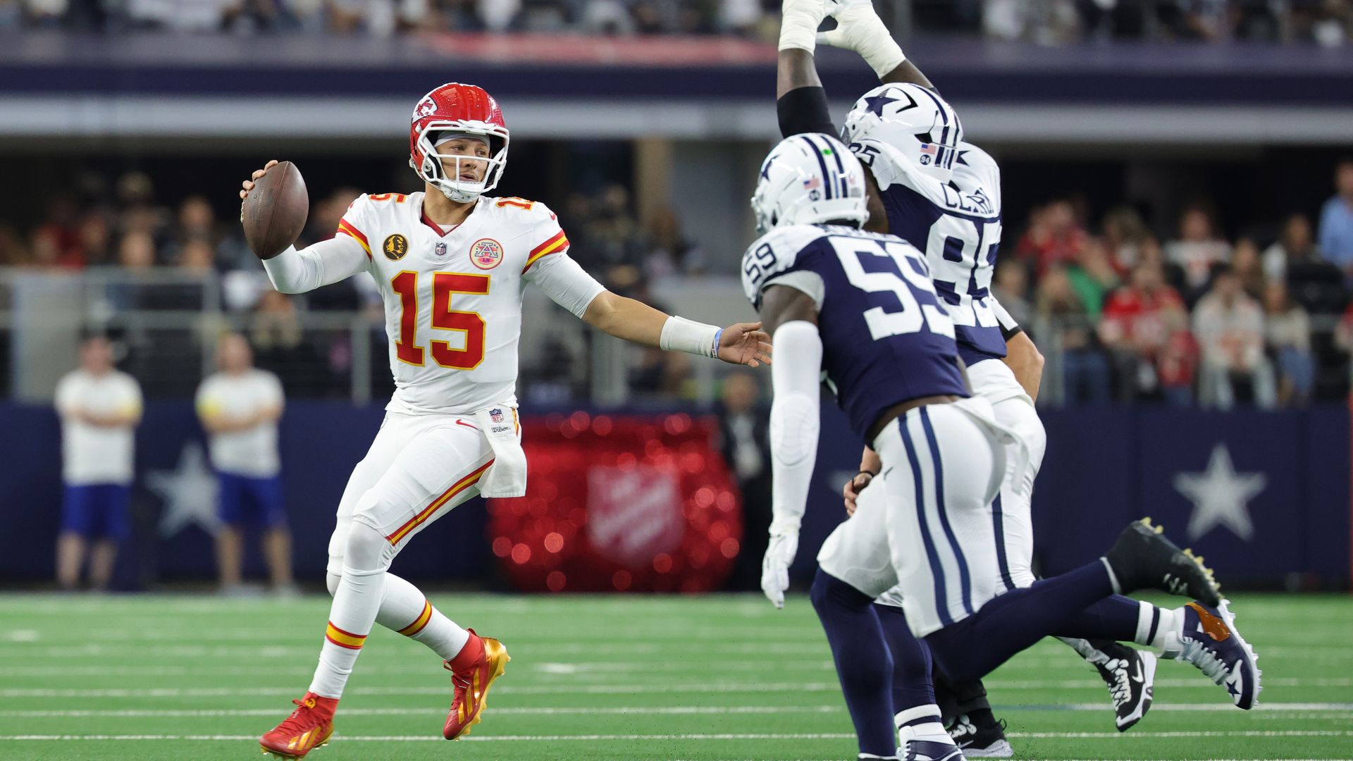 ARLINGTON, TEXAS - NOVEMBER 27: Patrick Mahomes #15 of the Kansas City Chiefs looks to pass the ball against Kenneth Murray Jr. #59 and Kenny Clark #95 of the Dallas Cowboys during the first quarter in the game at AT&T Stadium on November 27, 2025 in Arlington, Texas. (Photo by Stacy Revere/Getty Im