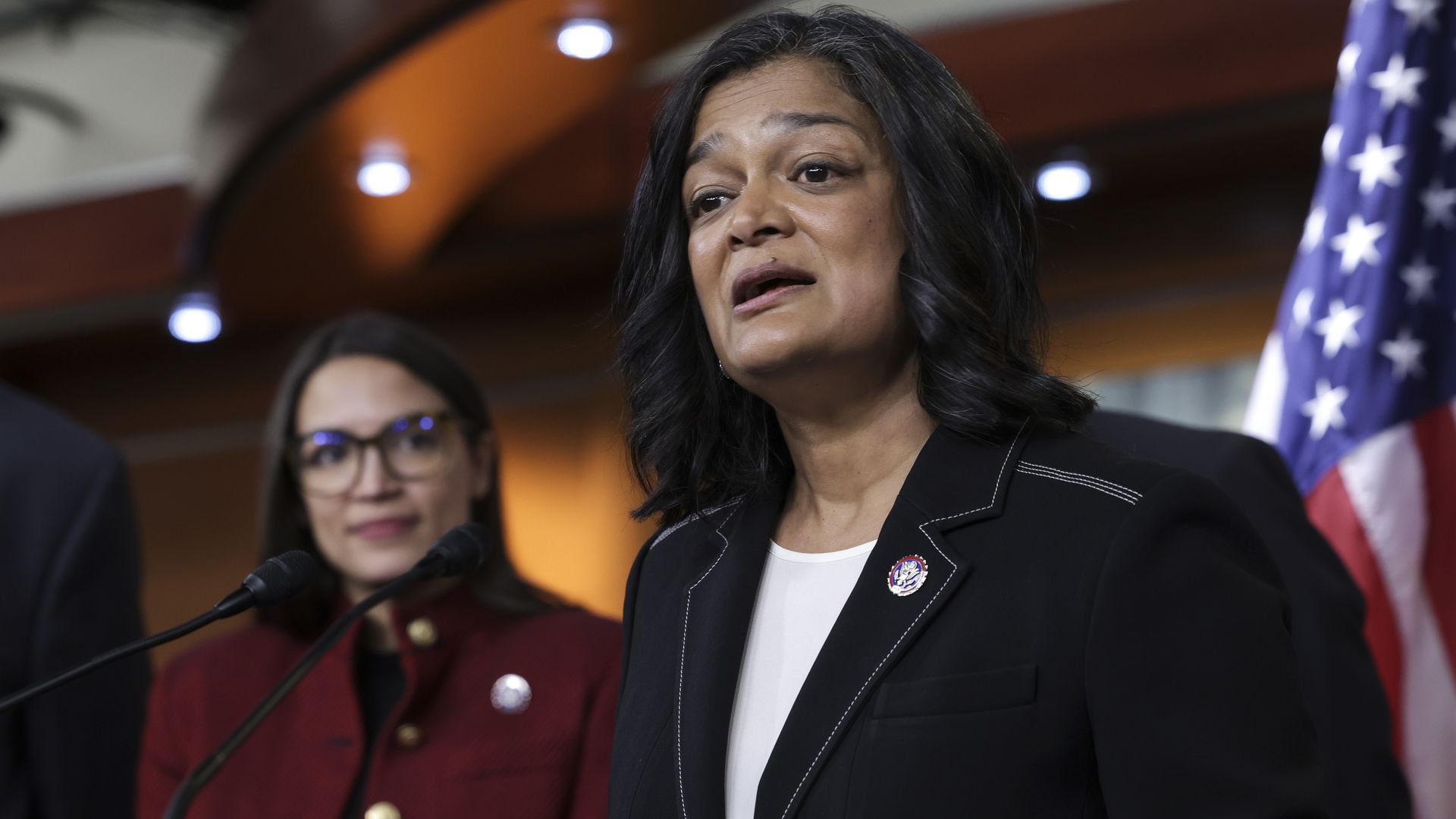 Reps. Alexandria Ocasio-Cortez and Pramila Jayapal at a press conference in Studio A in the U.S. Capitol.