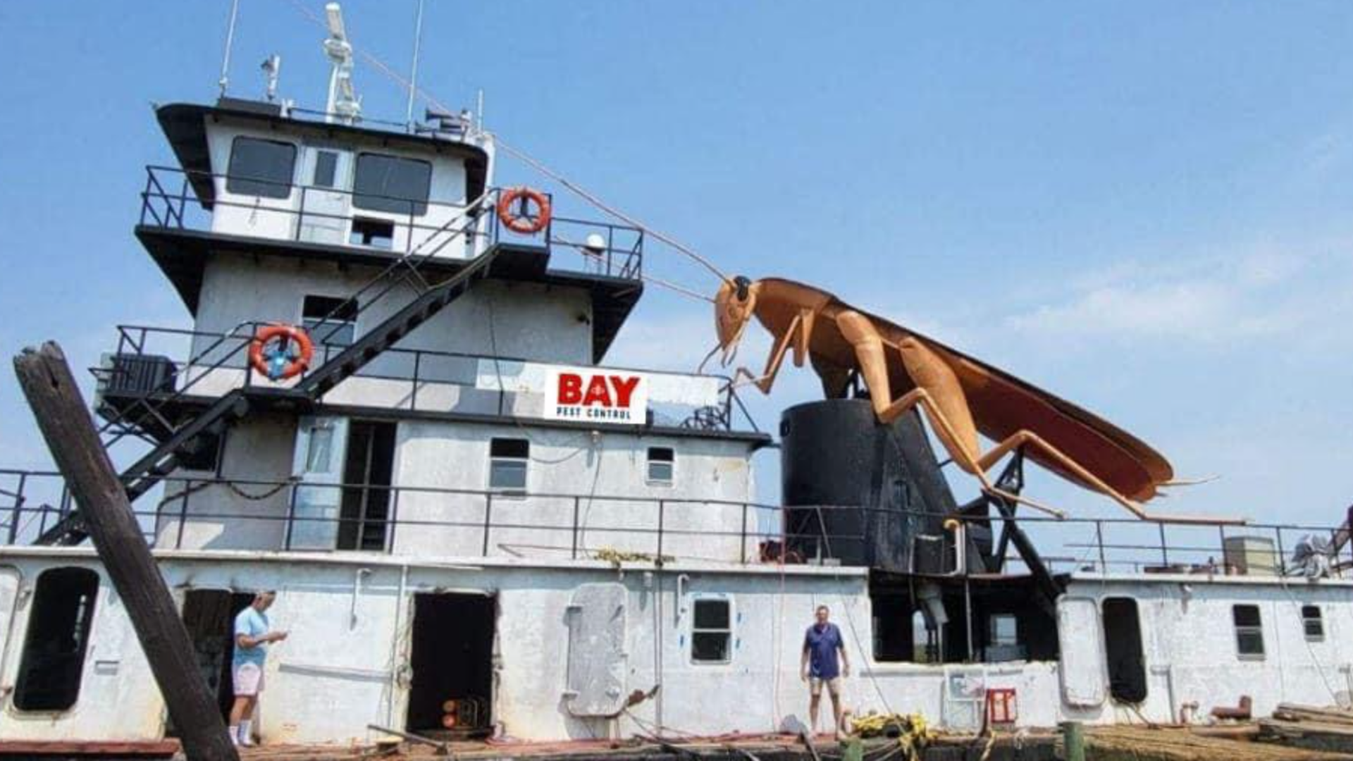 Photo shows a giant metal cockroach on a boat.