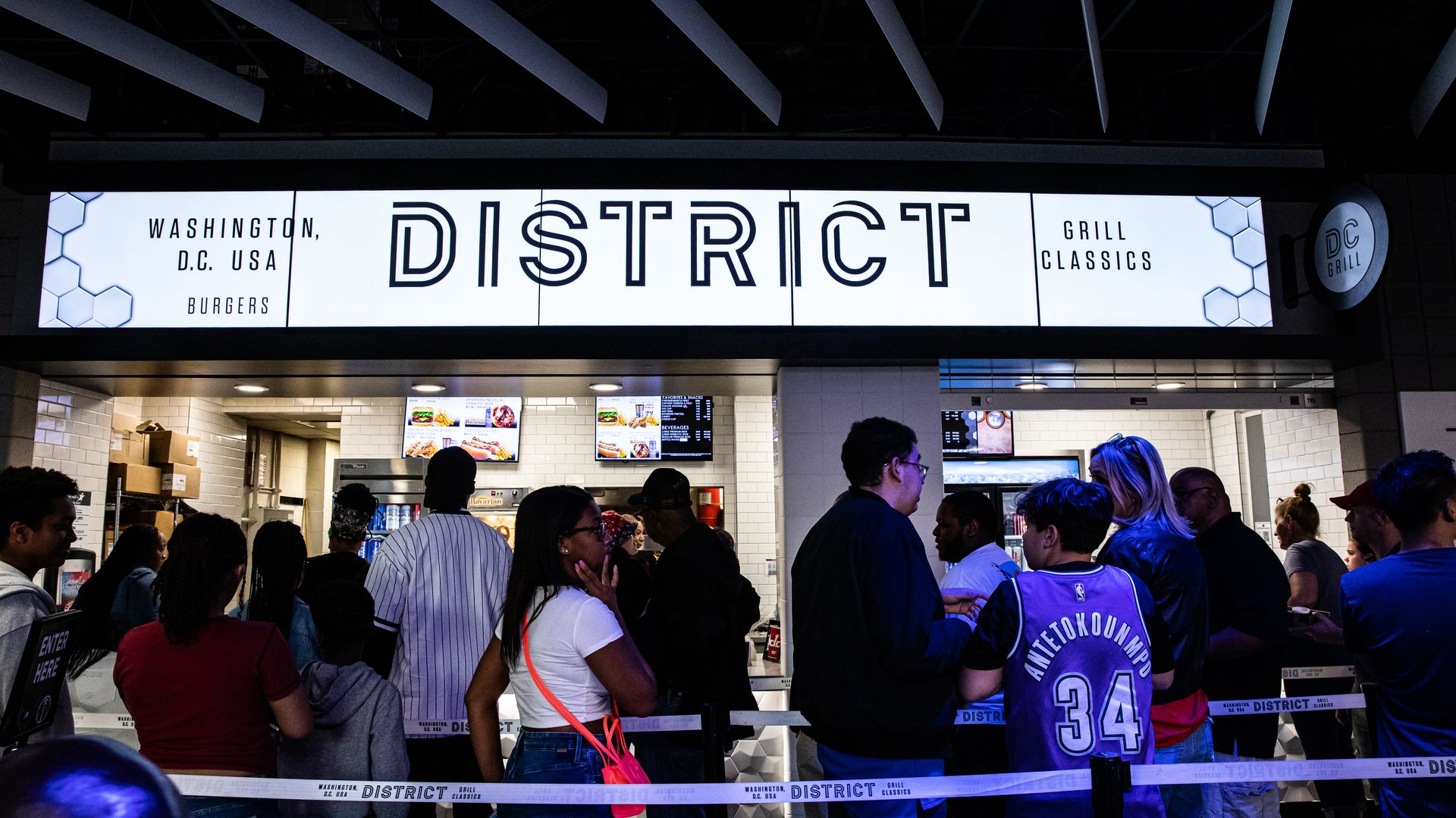Guests wait at a concession stand inside the Capital One Arena in Washington, DC, US, on Wednesday, April 5, 2023. Monumental Sports and Entertainment's revenues are approaching $1 billion annually, and CFO Peter Biche says the sports empire is "in growth mode." Photographer: Valerie Plesch/Bloomber
