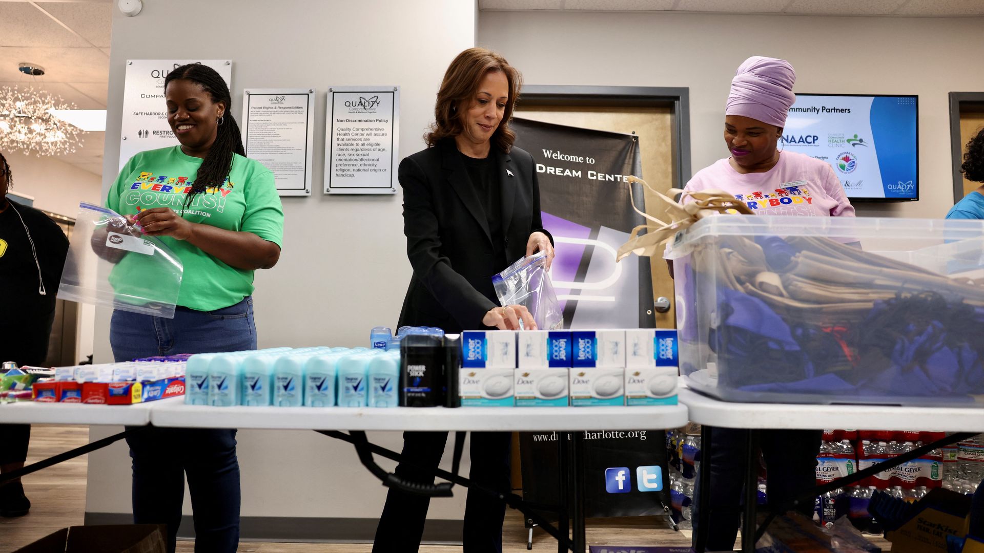 US Vice President Kamala Harris helps prepare hygiene related care packages at a health clinic 