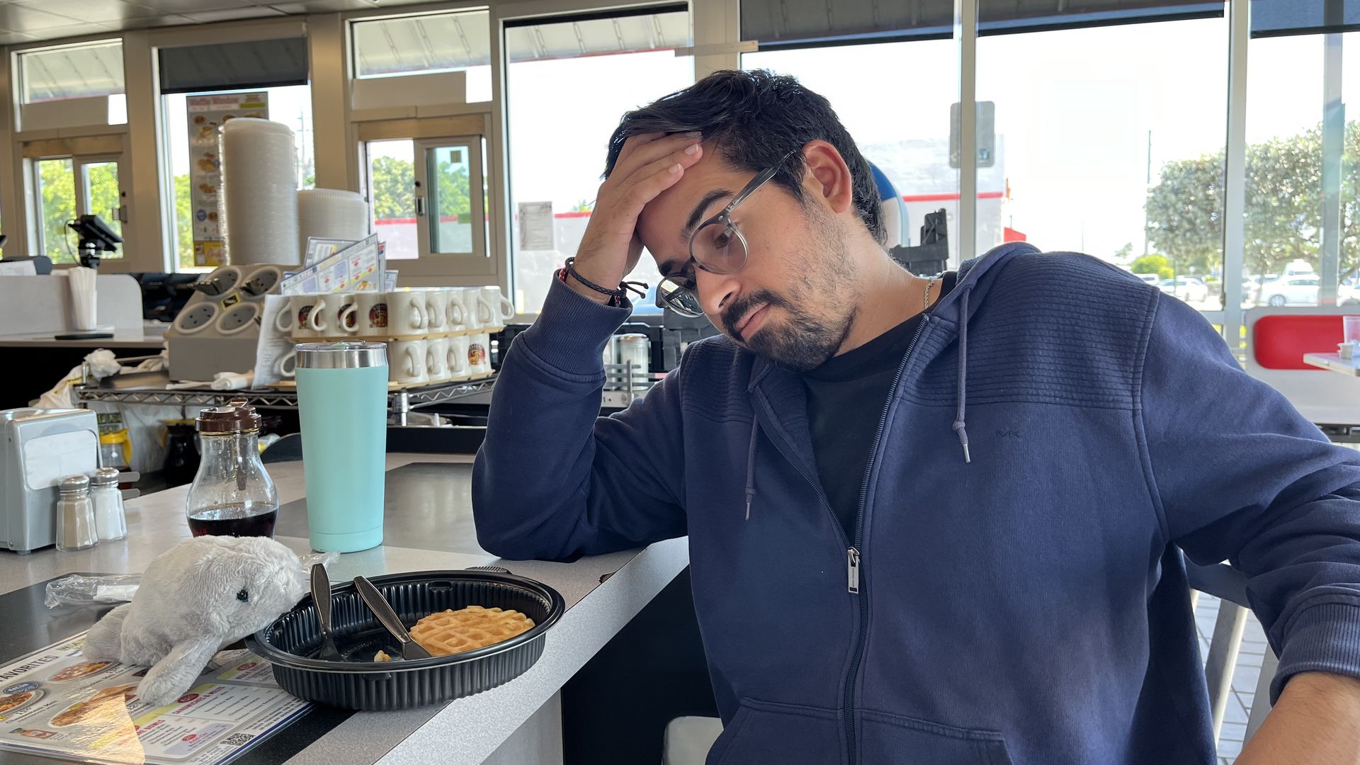 Martin Vassolo stressing over eating another waffle at Waffle House