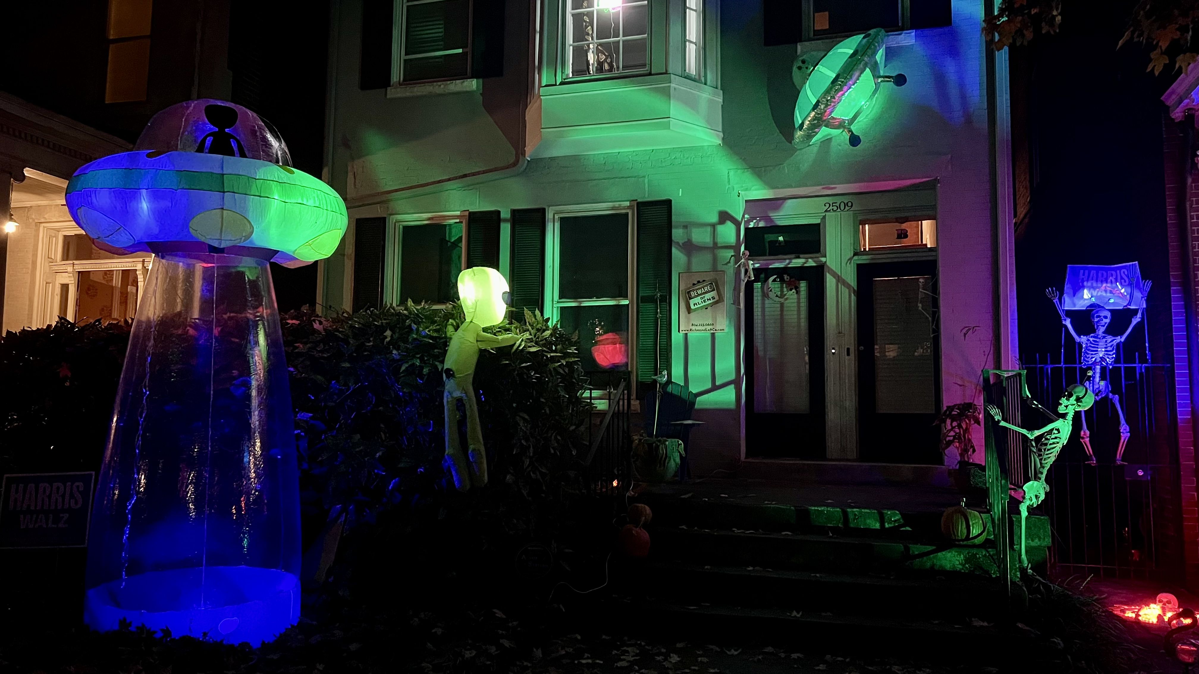 An alien lurking in the bushes while. his UFO is behind him 