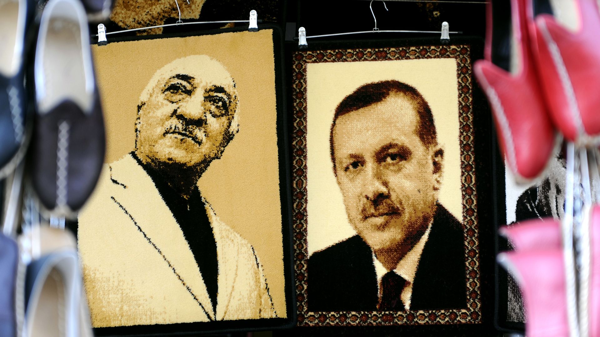 Embroidered images of Turkish cleric Fetullah Gulen (L) and President Recep Tayyip Erdogan (R)