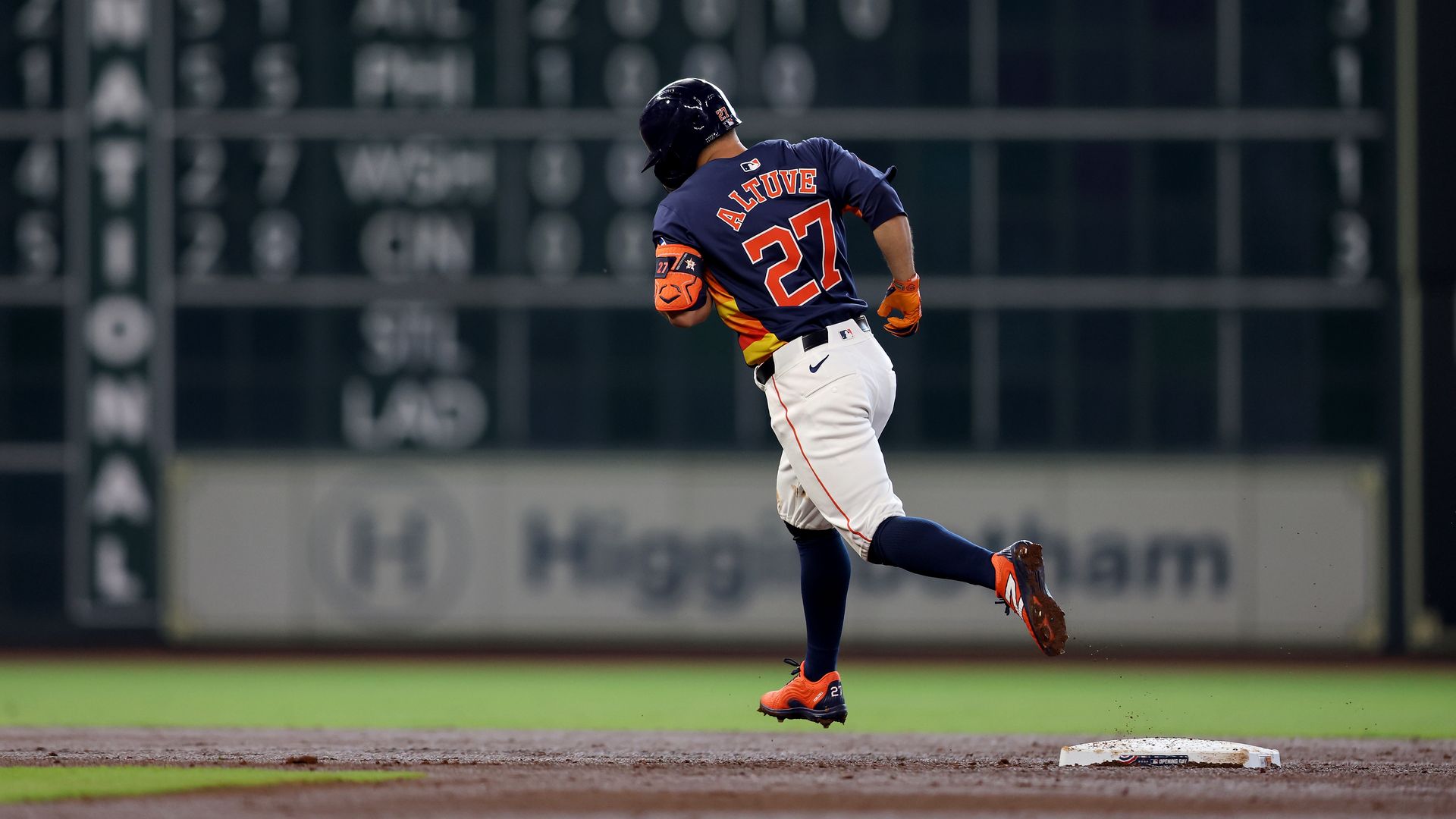 José Altuve rounds a base after hitting a home run inside Minute Maid Park 