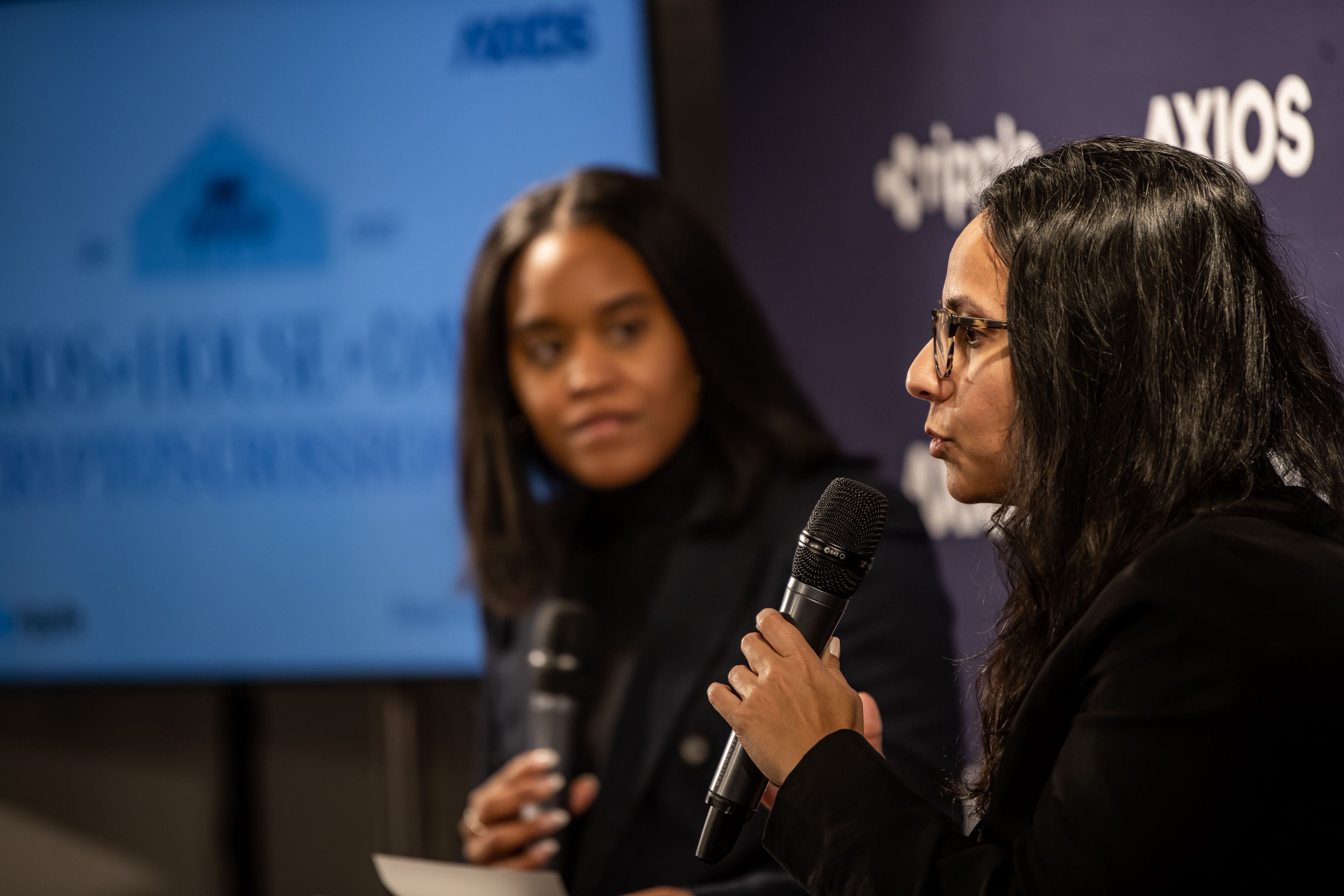 Neha Narula speaking to the audience alongside Axios’ Courtenay Brown.
