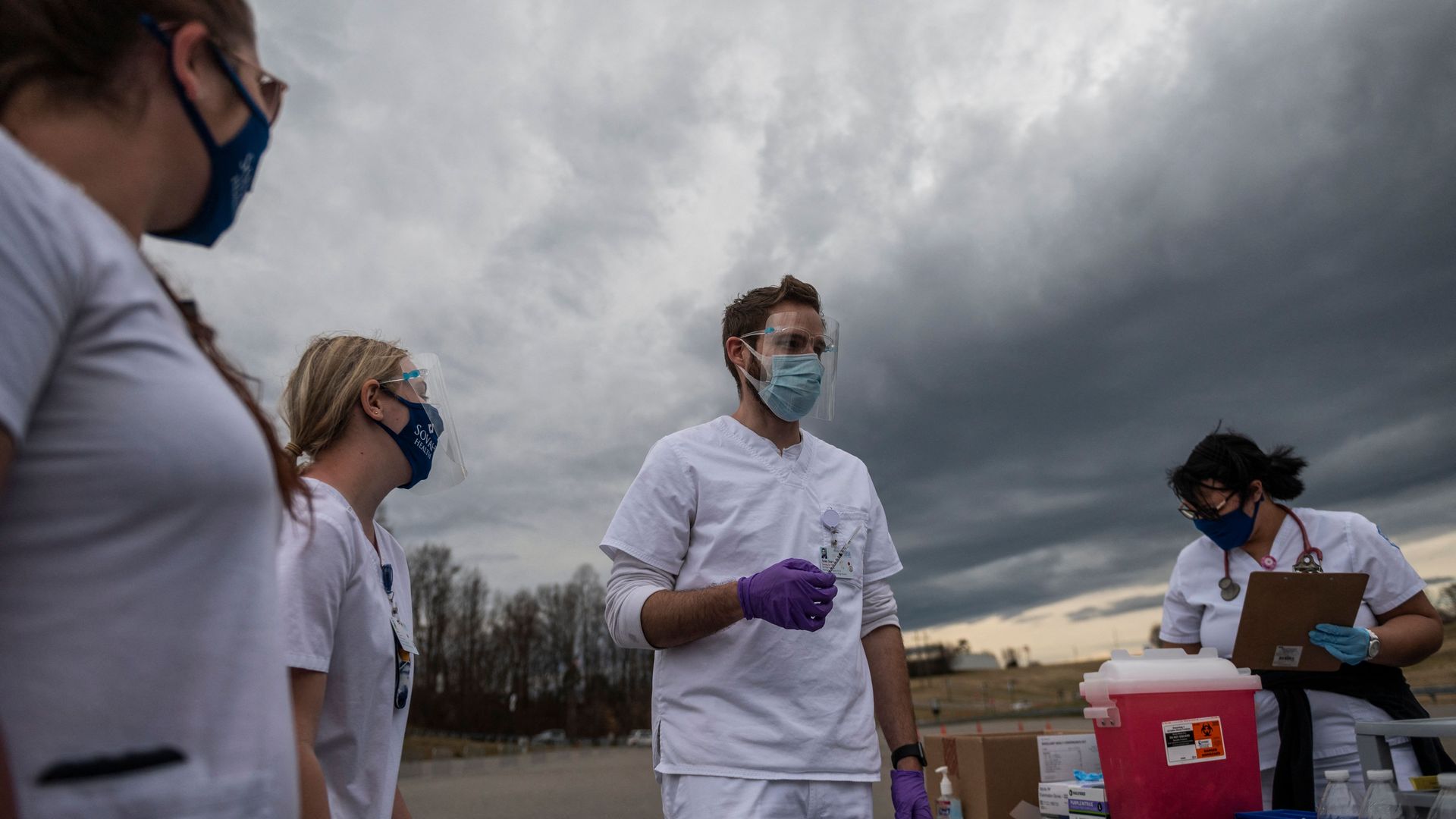 health workers outside with masks on