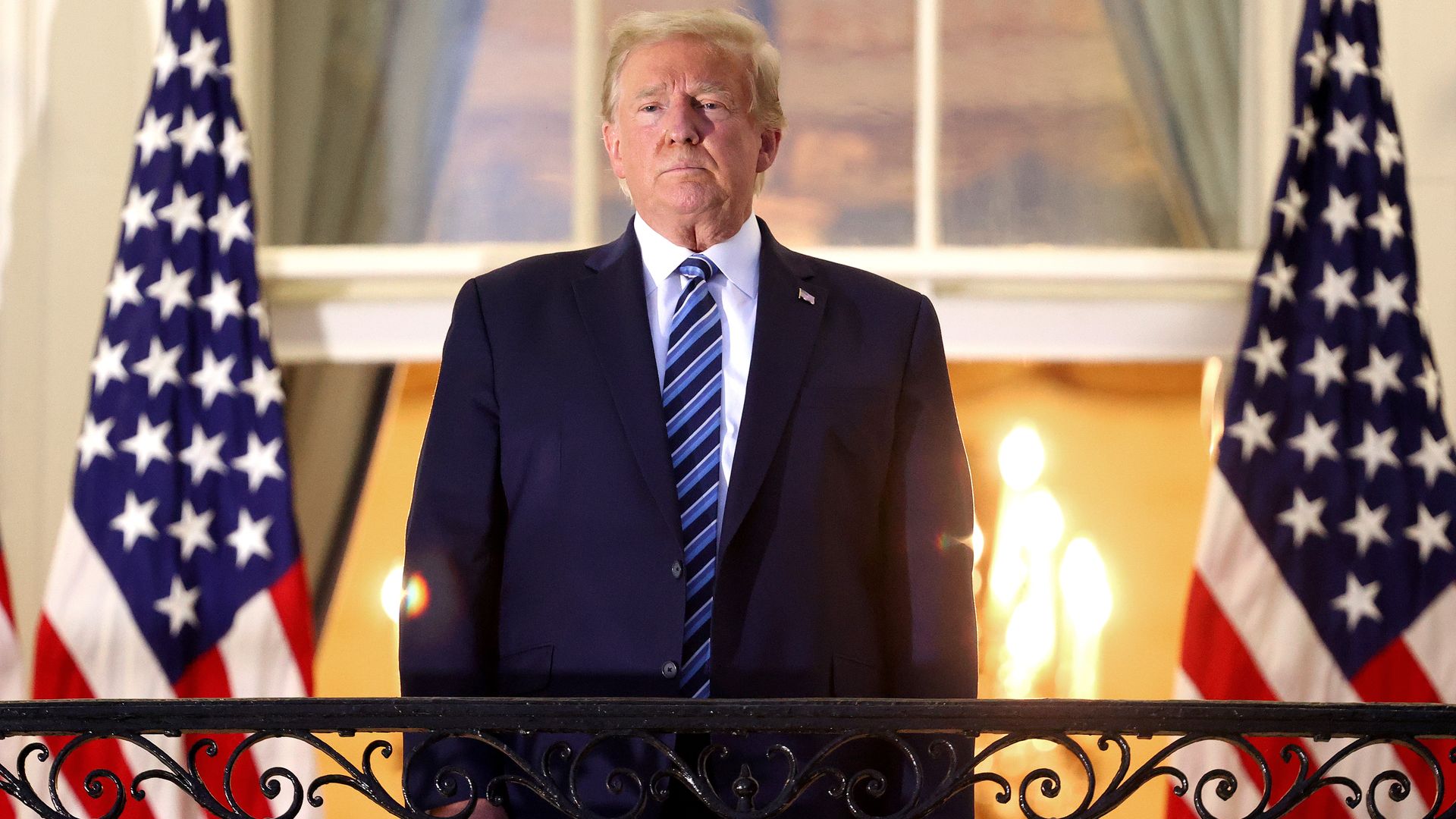 Trump standing on the Truman Balcony after returning to the White House from Walter Reed Medical Center on Oct. 5.