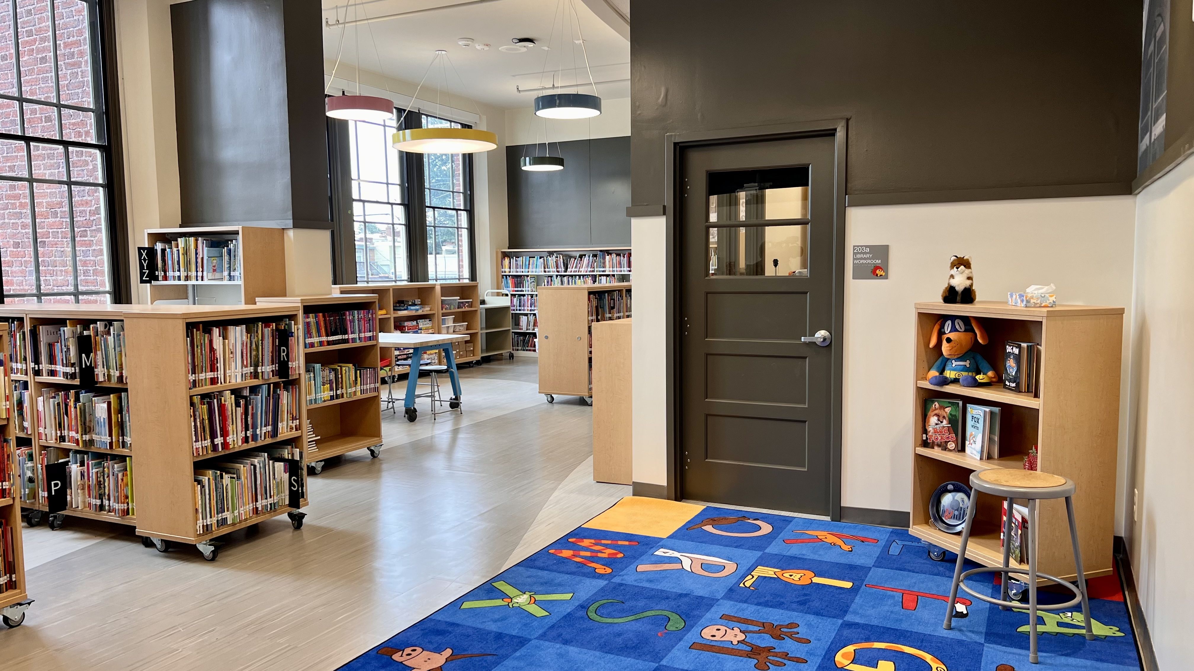 a library with books in wooden shelves