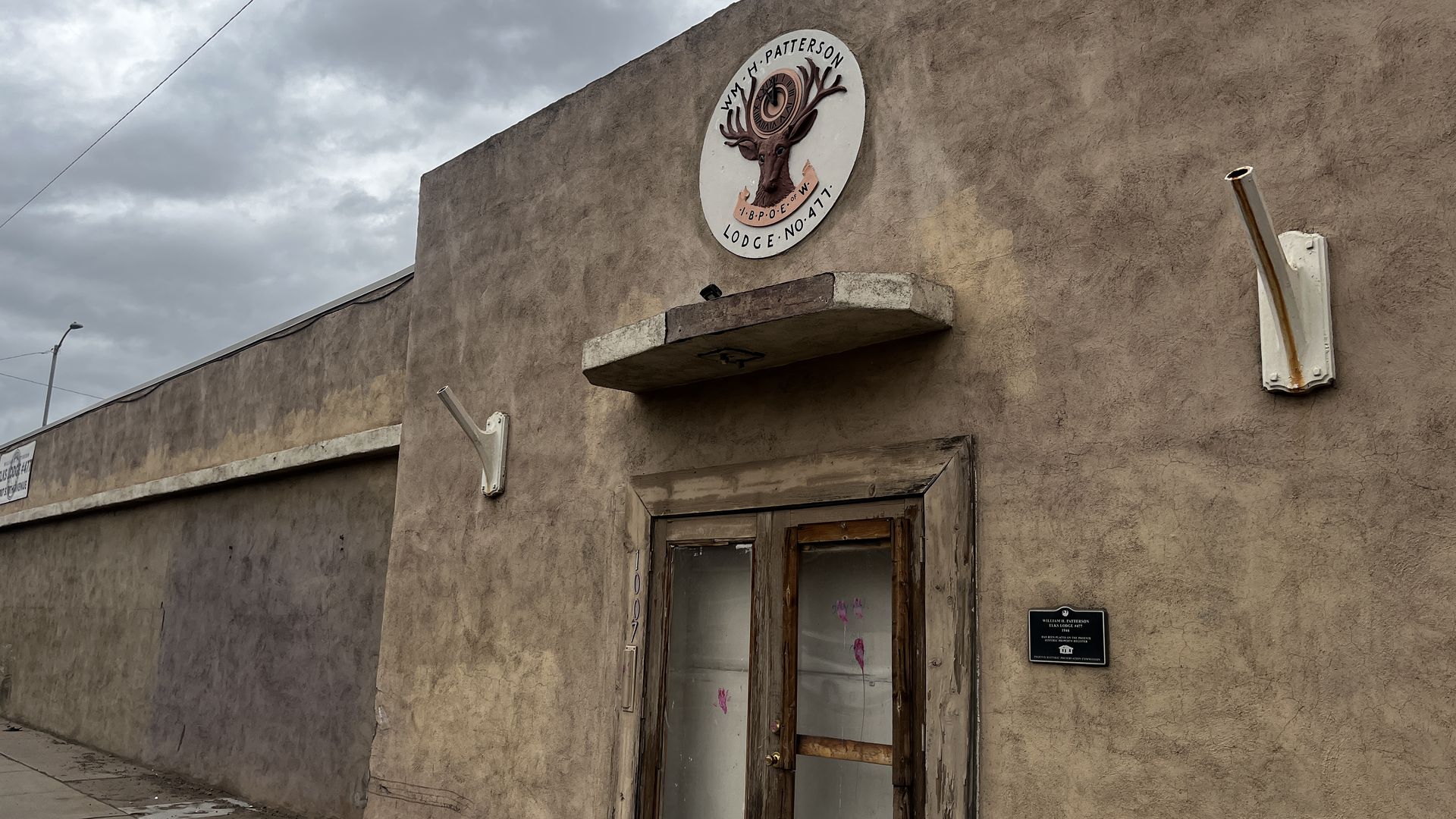 An old building with elk emblem. 
