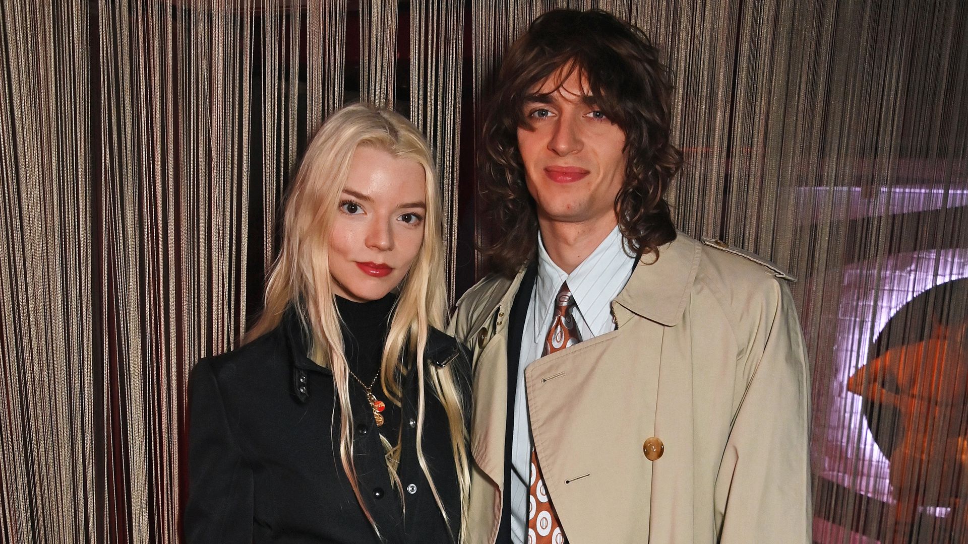 Anya Taylor-Joy and Malcom McRae pose for a photo.