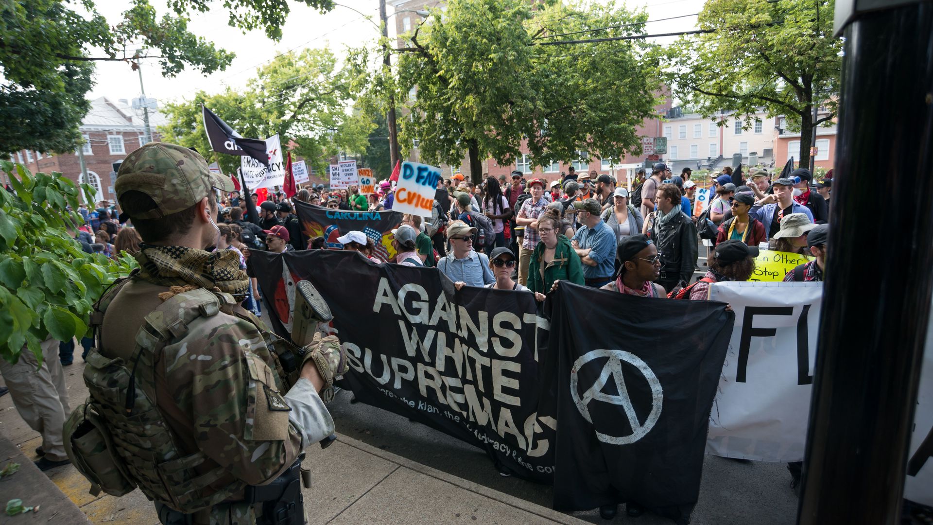 A police officer observes as a group of anti white supremacists protest in Charlottesville, Virginia