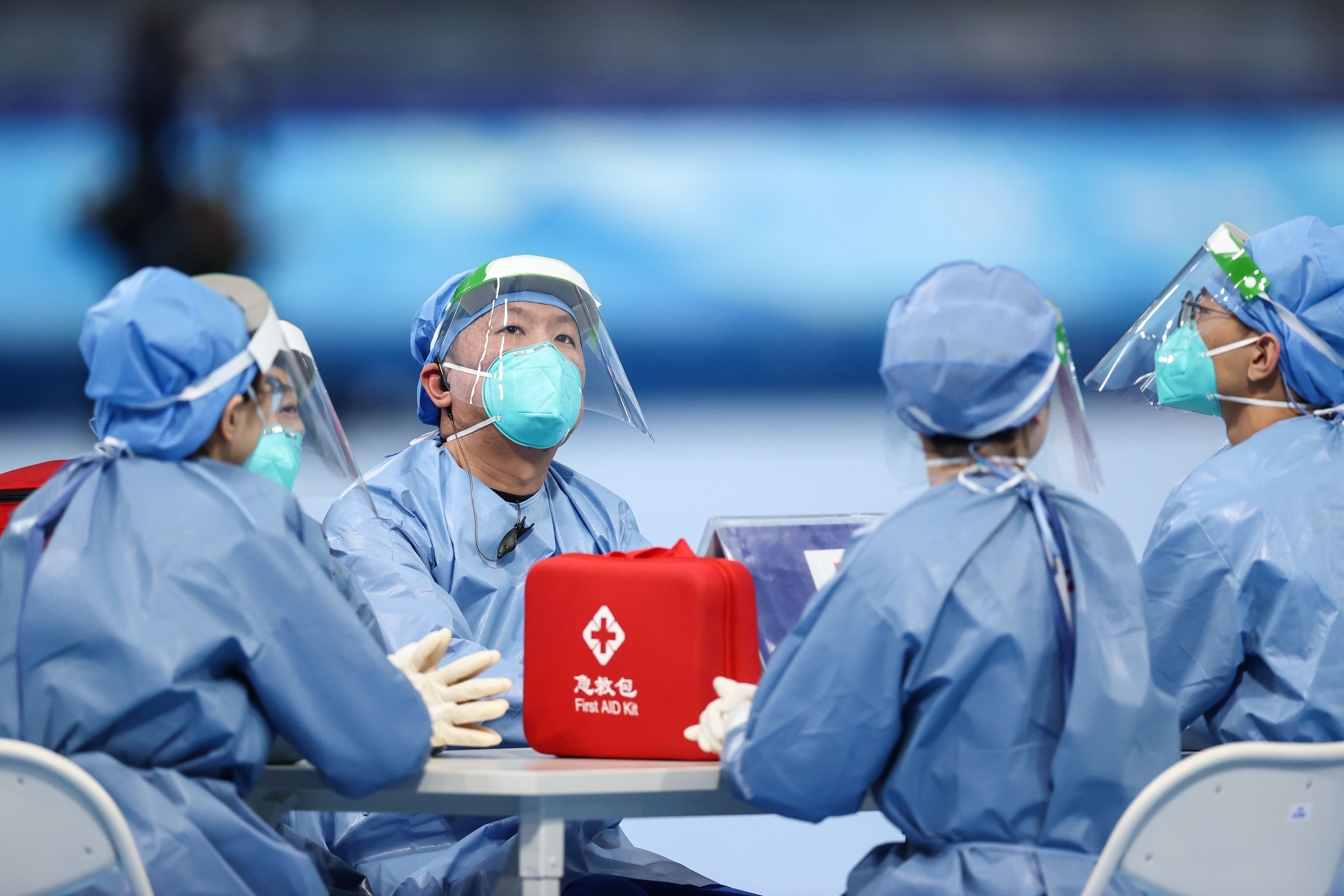 ealthcare workers are seen during women's 3000m speed skating race during the Beijing 2022 Winter Olympic Games at the National Speed Skating Oval .