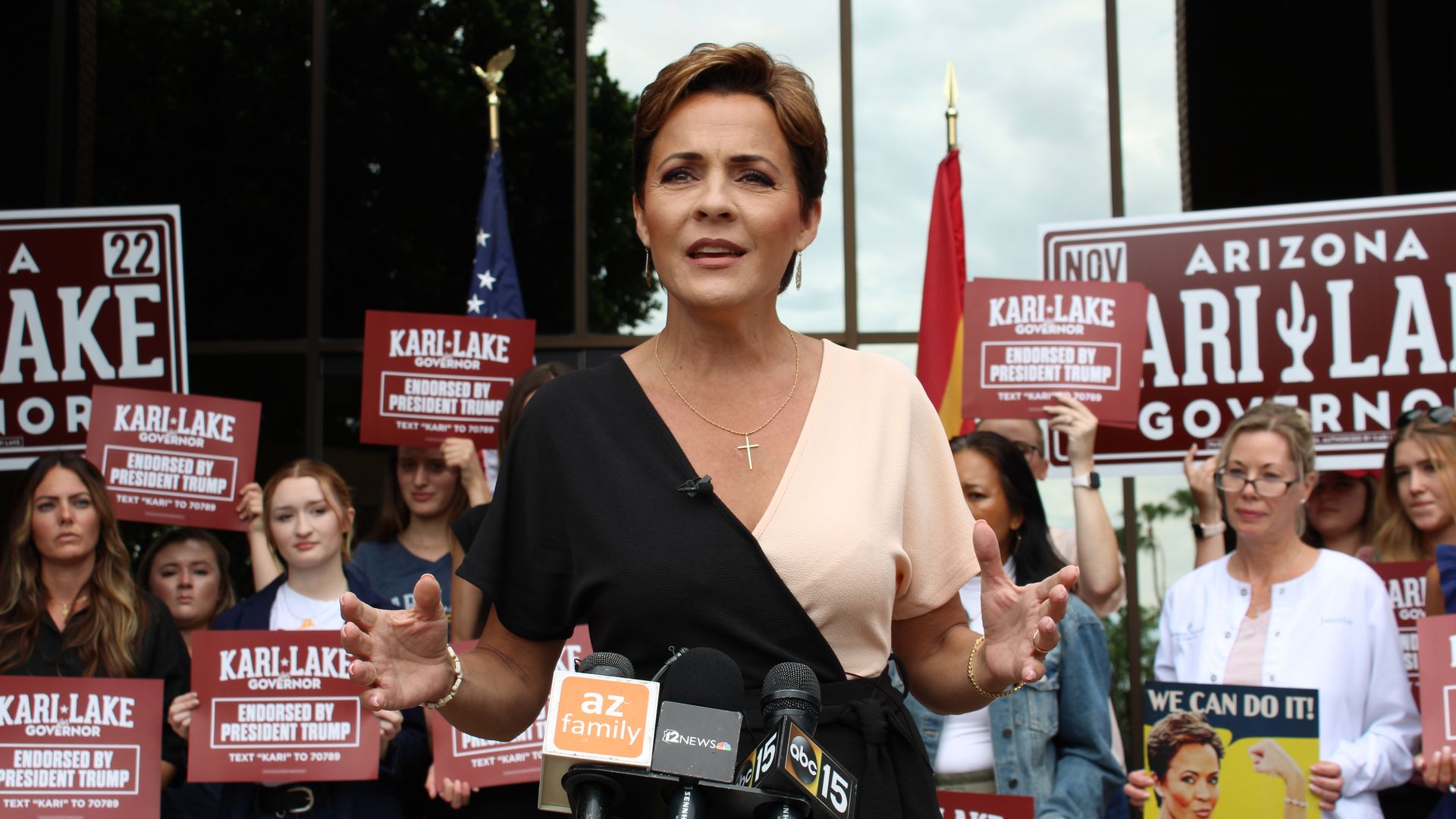 Kari Lake speaks to the media during a press conference in front of her campaign headquarters