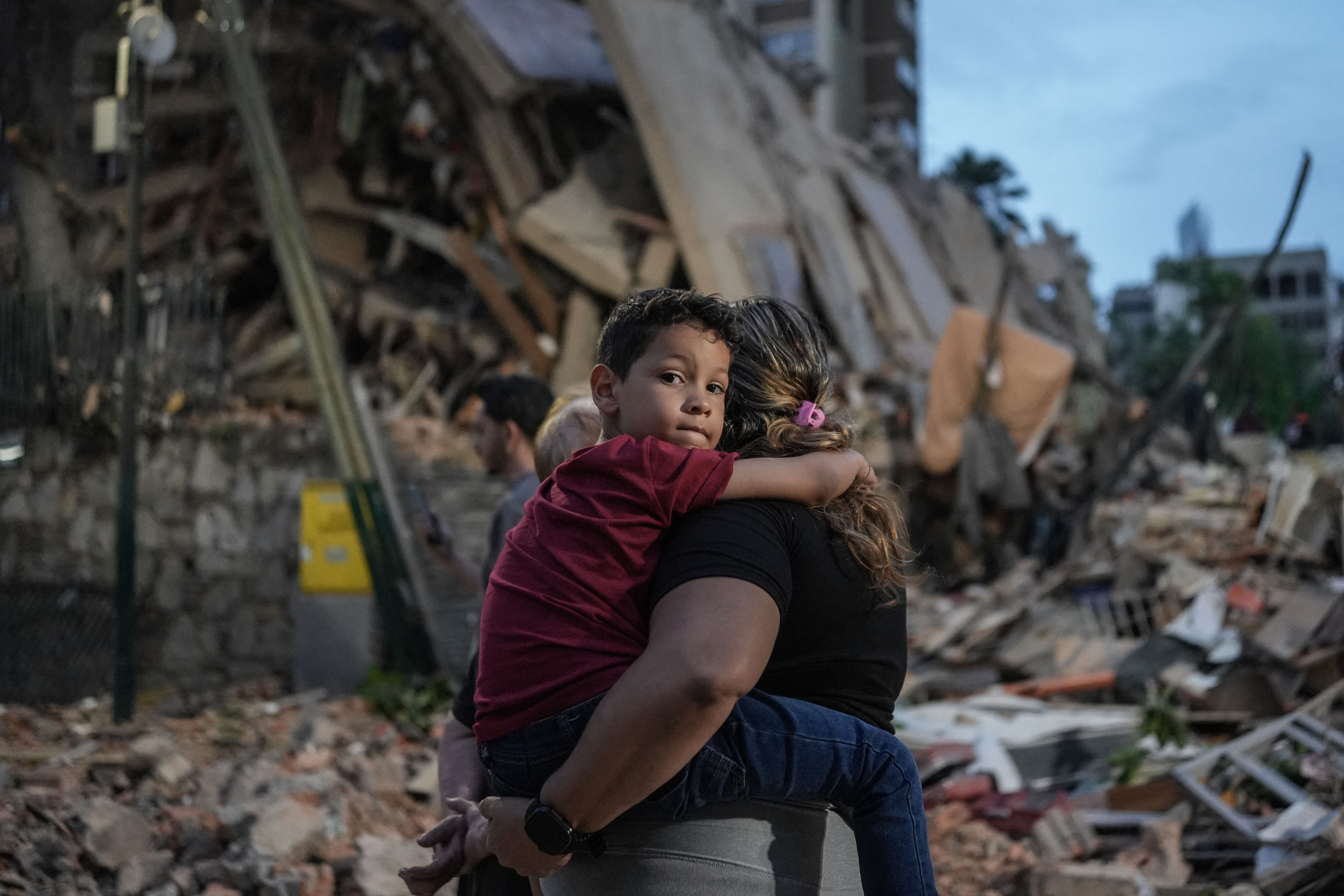 Onlookers yesterday near a collapsed building in Caracas, Venezuela. Photo: Manaure Quintero/AFP via Getty Images