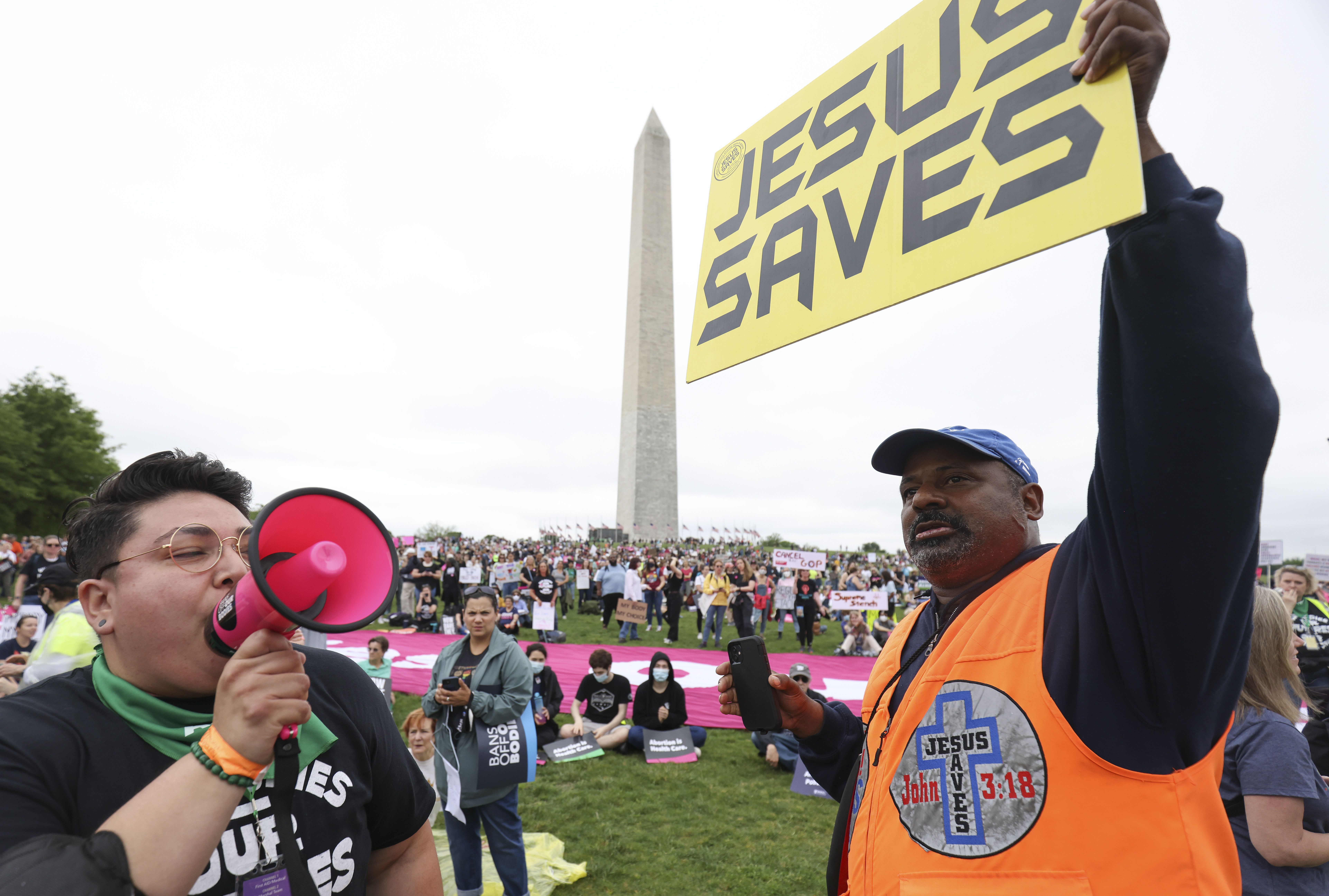 An abortion rights activist and a counter demonstrator at the Washington Monument on May 14.