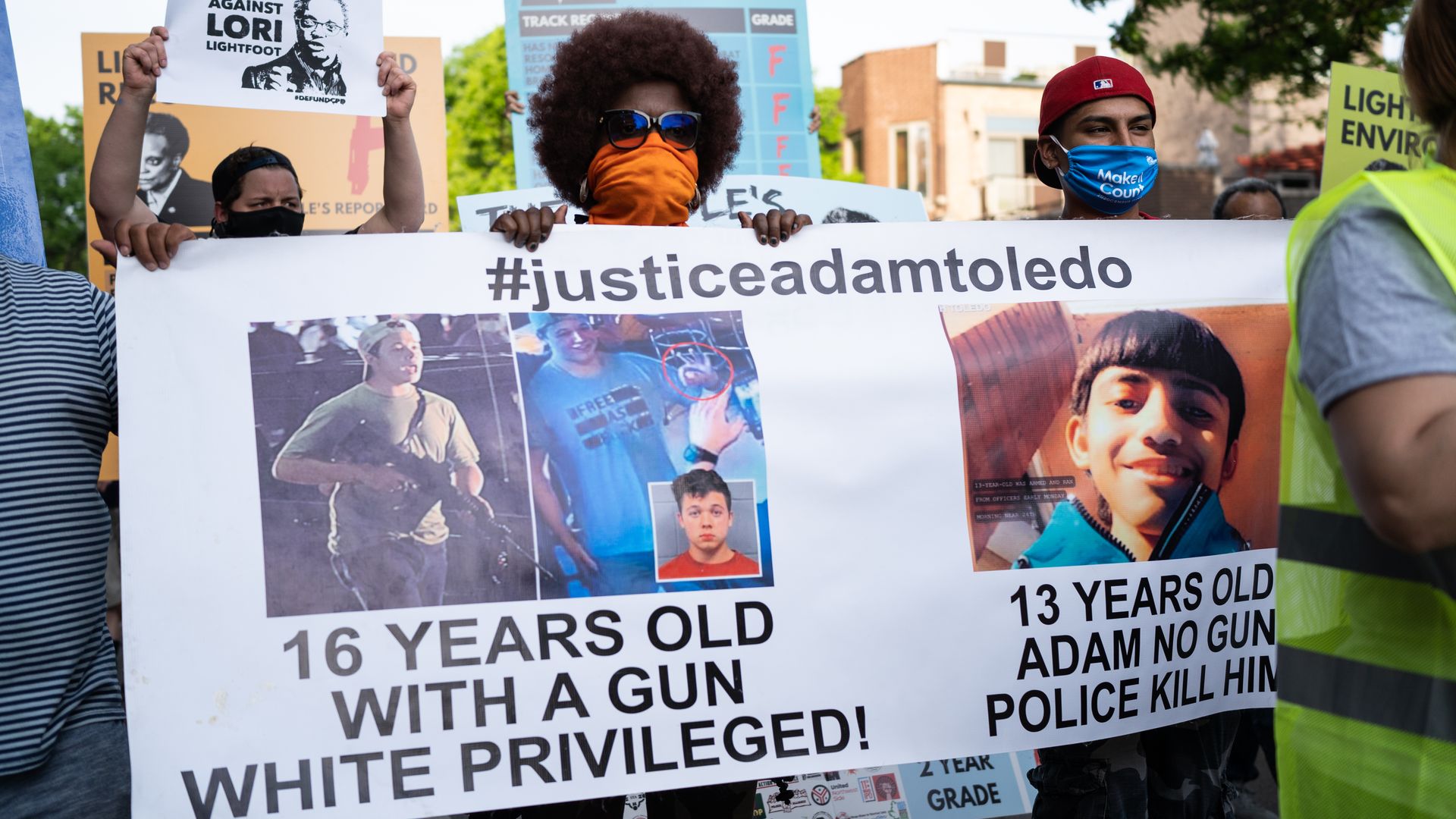 Carolyn Ruff, with Black Lives Matter Women of Faith, brings awareness to the police killing of 13-year-old Adam Toledo during a protest.