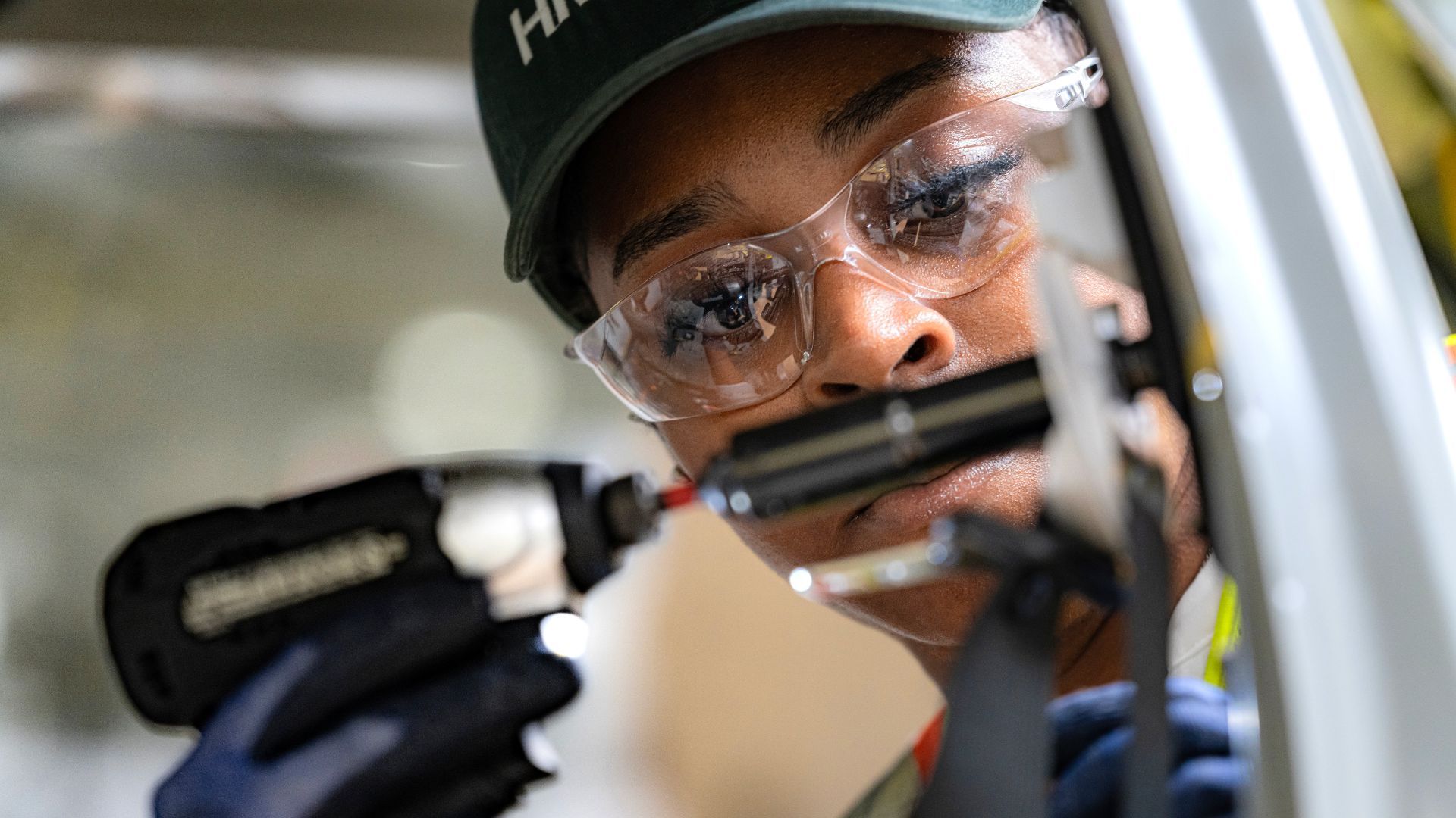 Someone using tools in a factory