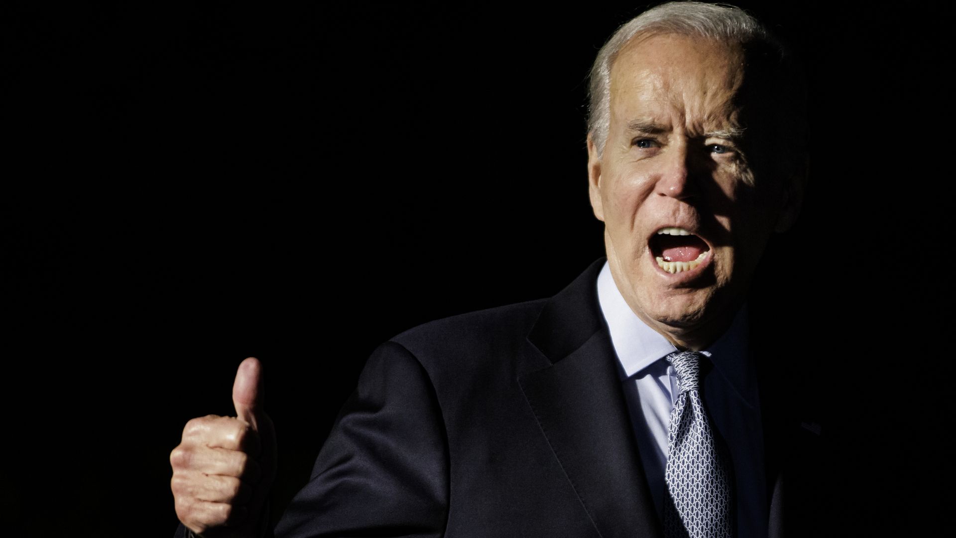 President Biden gives a yell and thumbs up 