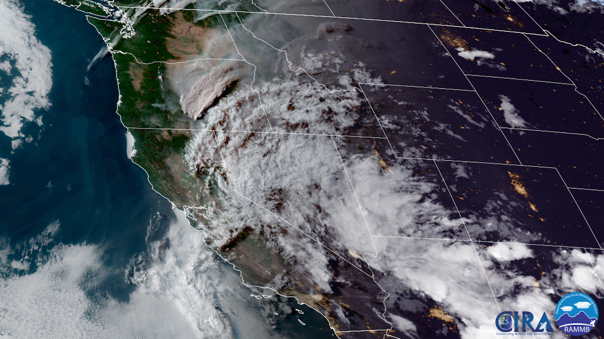 Satellite image showing wildfire smoke plume and thunderstorms from space.