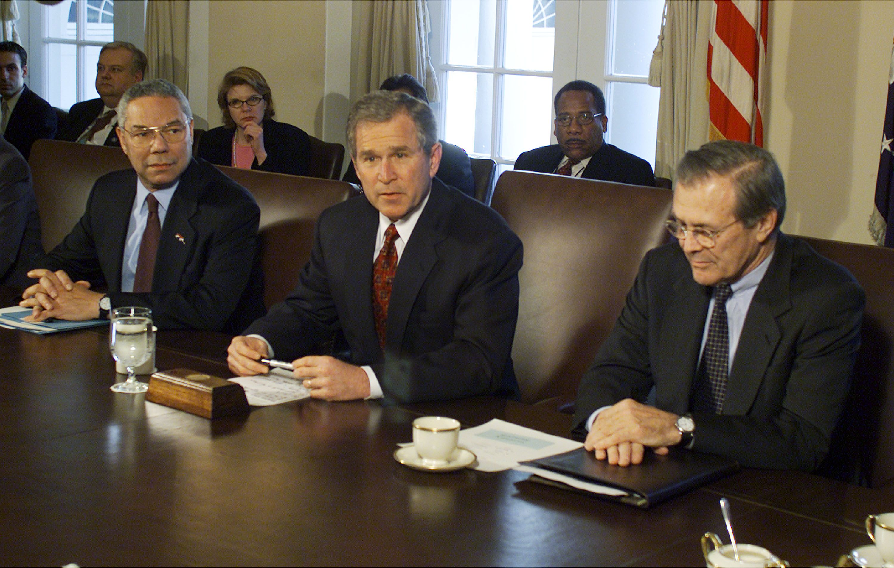 George Bush holds a cabinet meeting with Secretary of Defense Donald Rumsfeld and Secretary of State Colin Powell. 