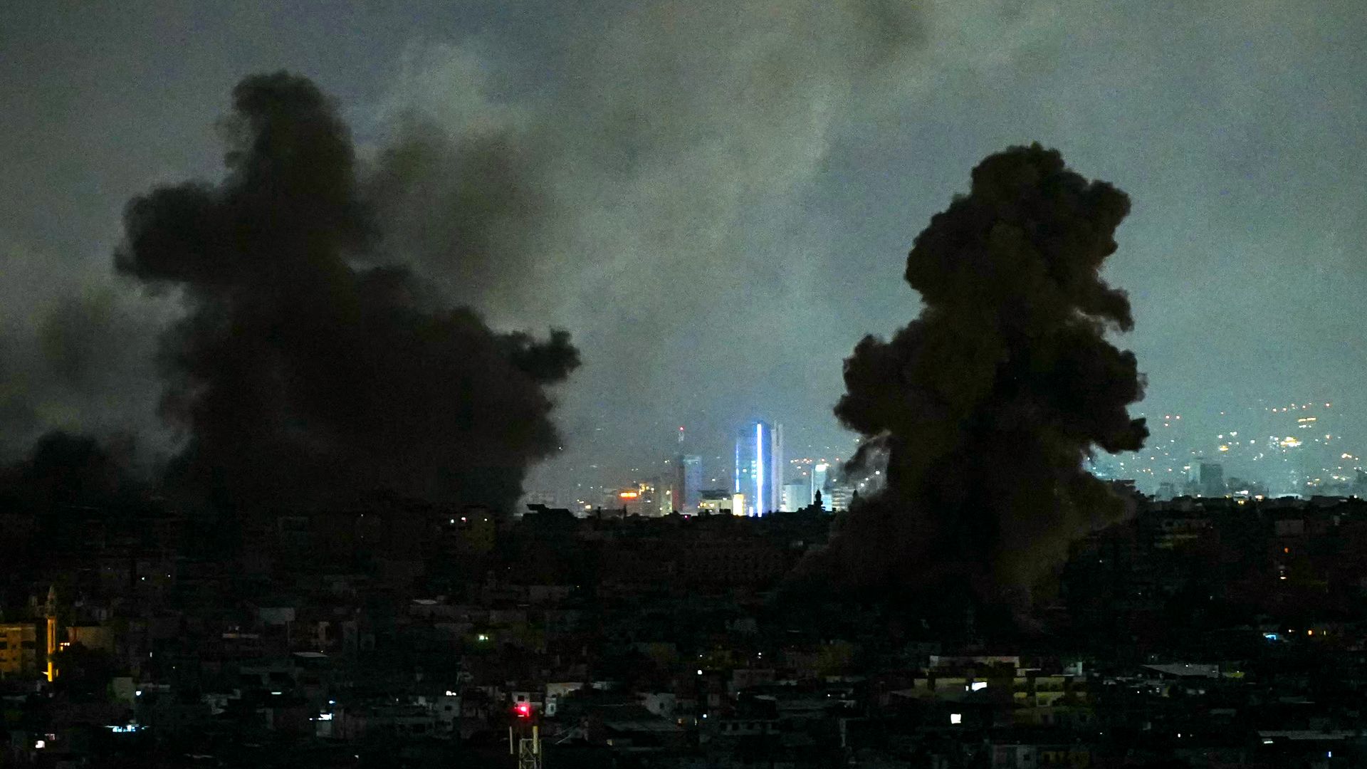 Smoke plumes with skylinebehind