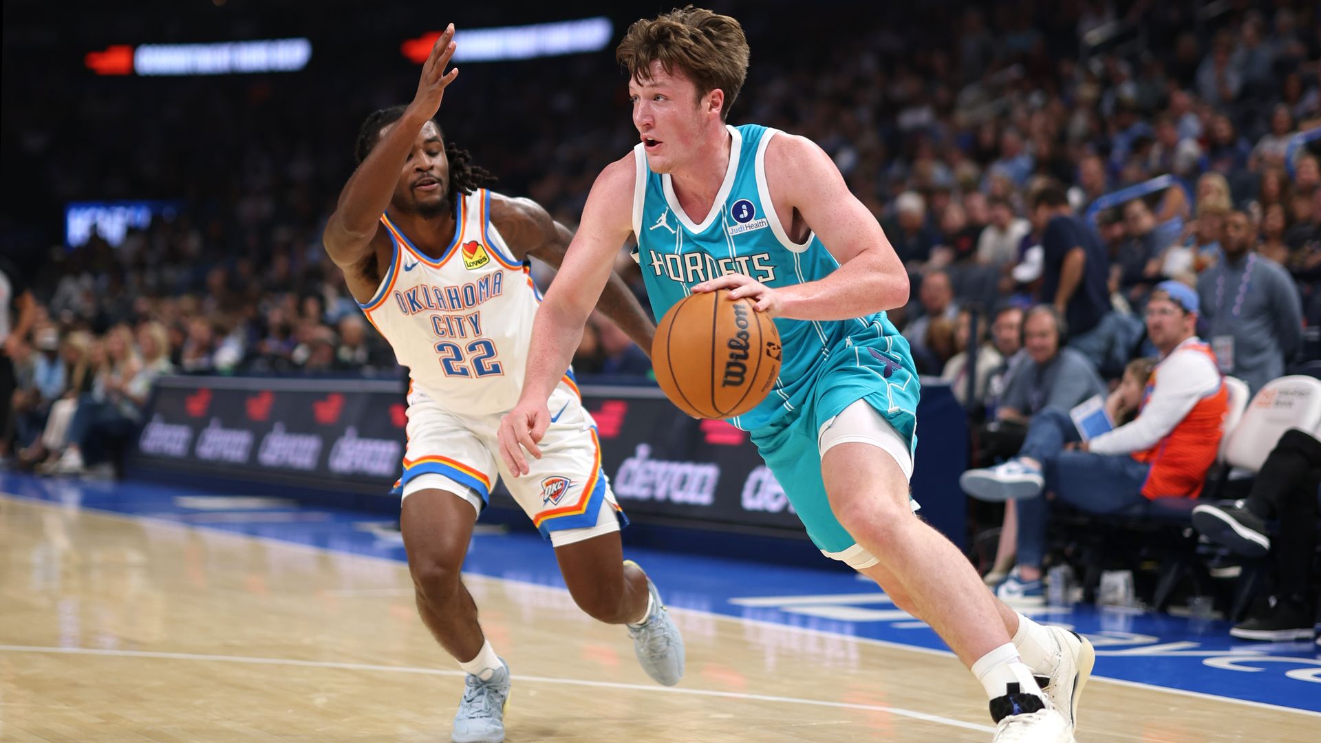 Kon Knueppel #7 of the Charlotte Hornets drives to the basket during the game against the Oklahoma City Thunder during Preseason on October 9, 2025 at Paycom Center in Oklahoma City, Oklahoma.