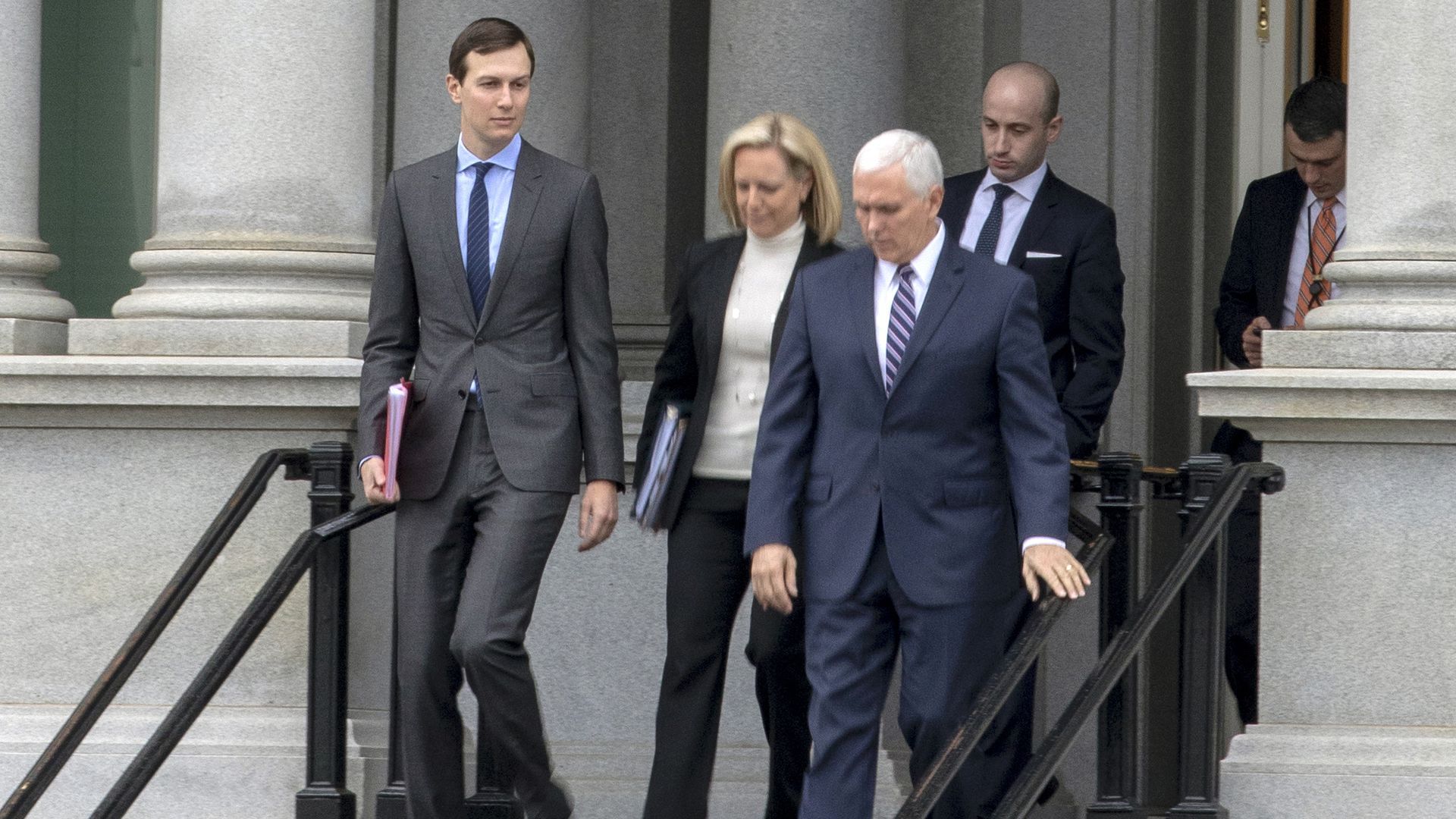 Jared Kushner walks down stairs followed by Mike Pence, Kirstjen Nielsen and Stephen Miller