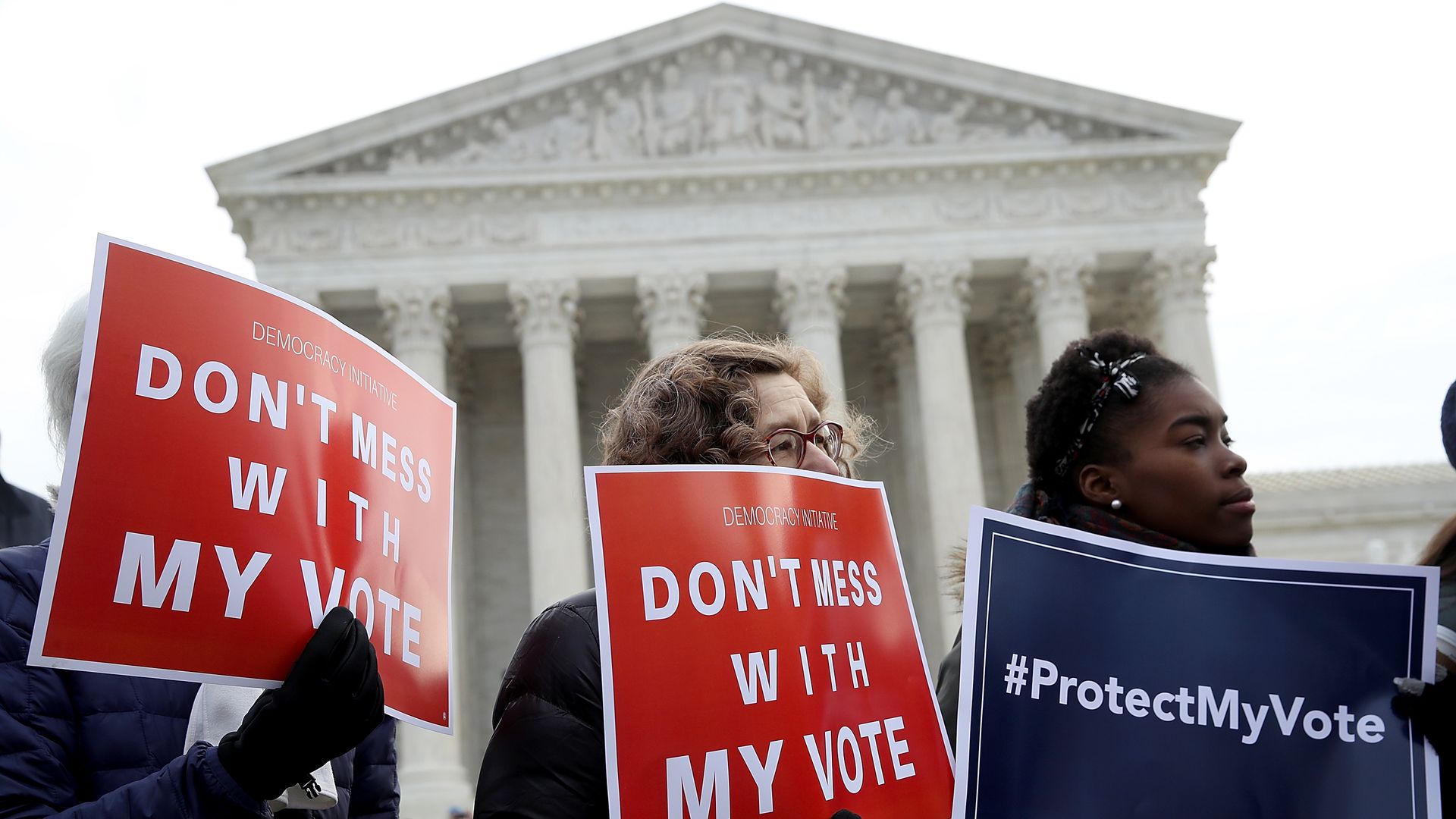 Protesters outside the U.S. Supreme Court Cause in January it is hears arguments in a challenge to Ohio's voter roll purges. 
