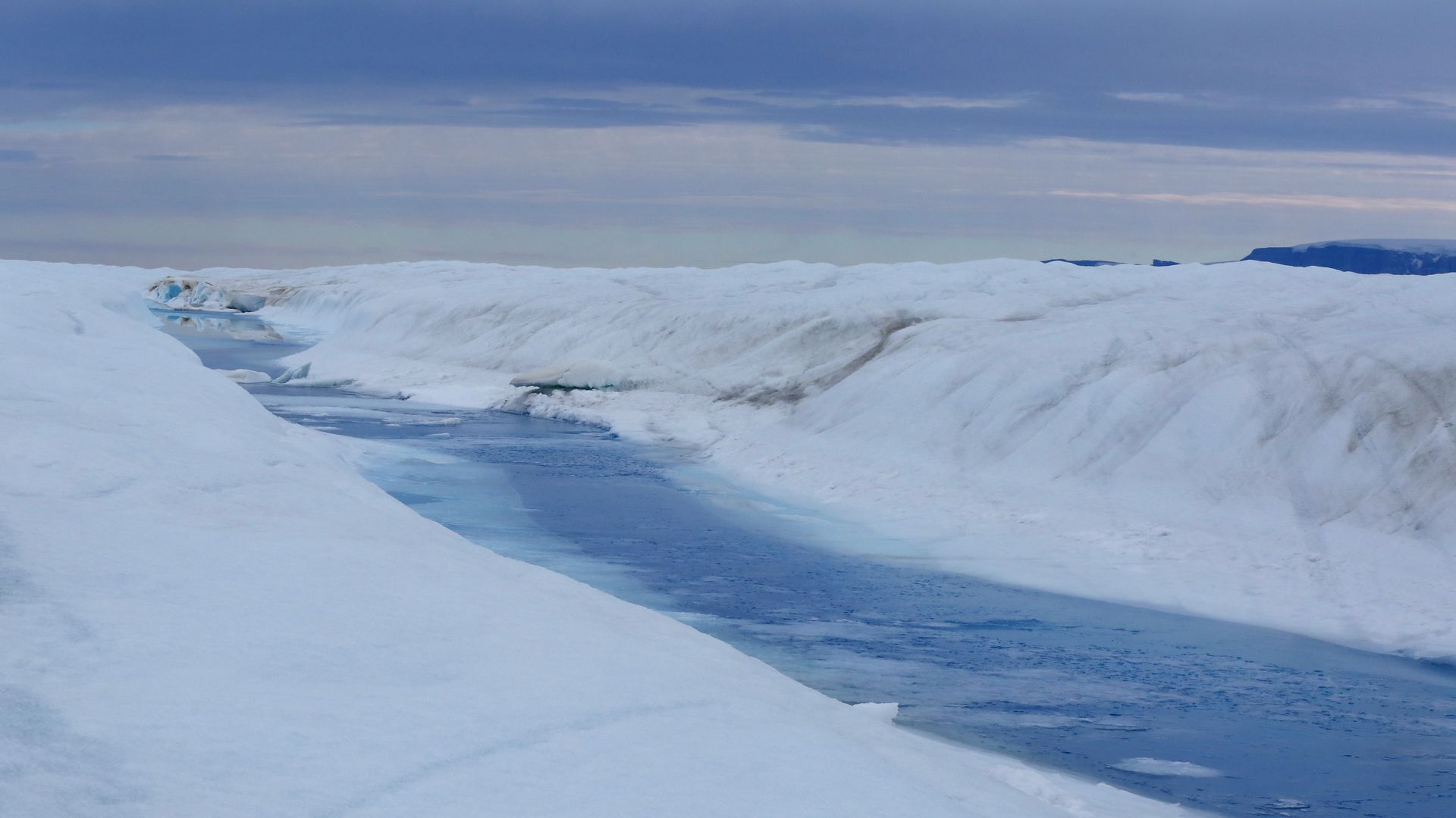 A picture of meltwater flowing on top Petermann Glacier in northwestern Greenland in 2016.